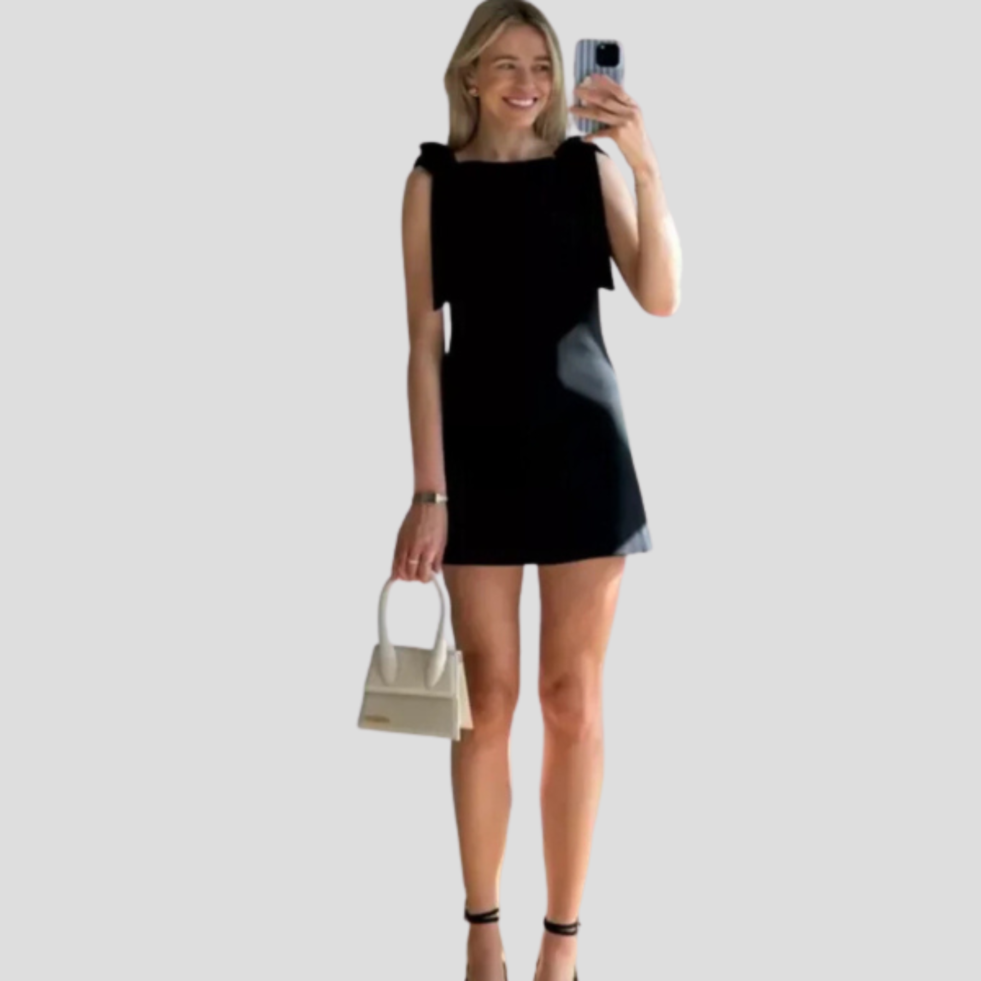 Black bow strap mini dress with A-line silhouette for evening wear