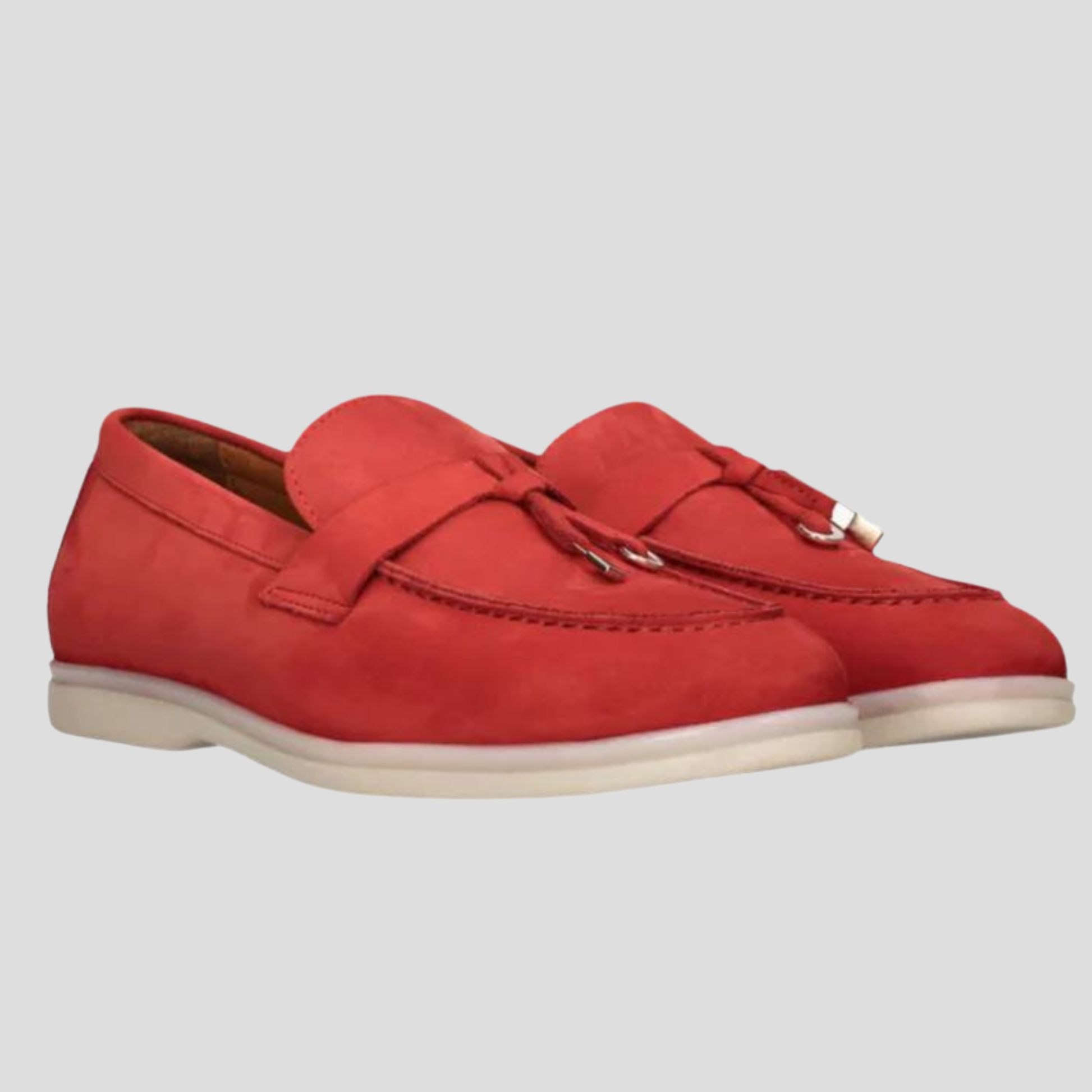 Women's tassel slip-on loafers with a clean silhouette, shown in a neutral colorway