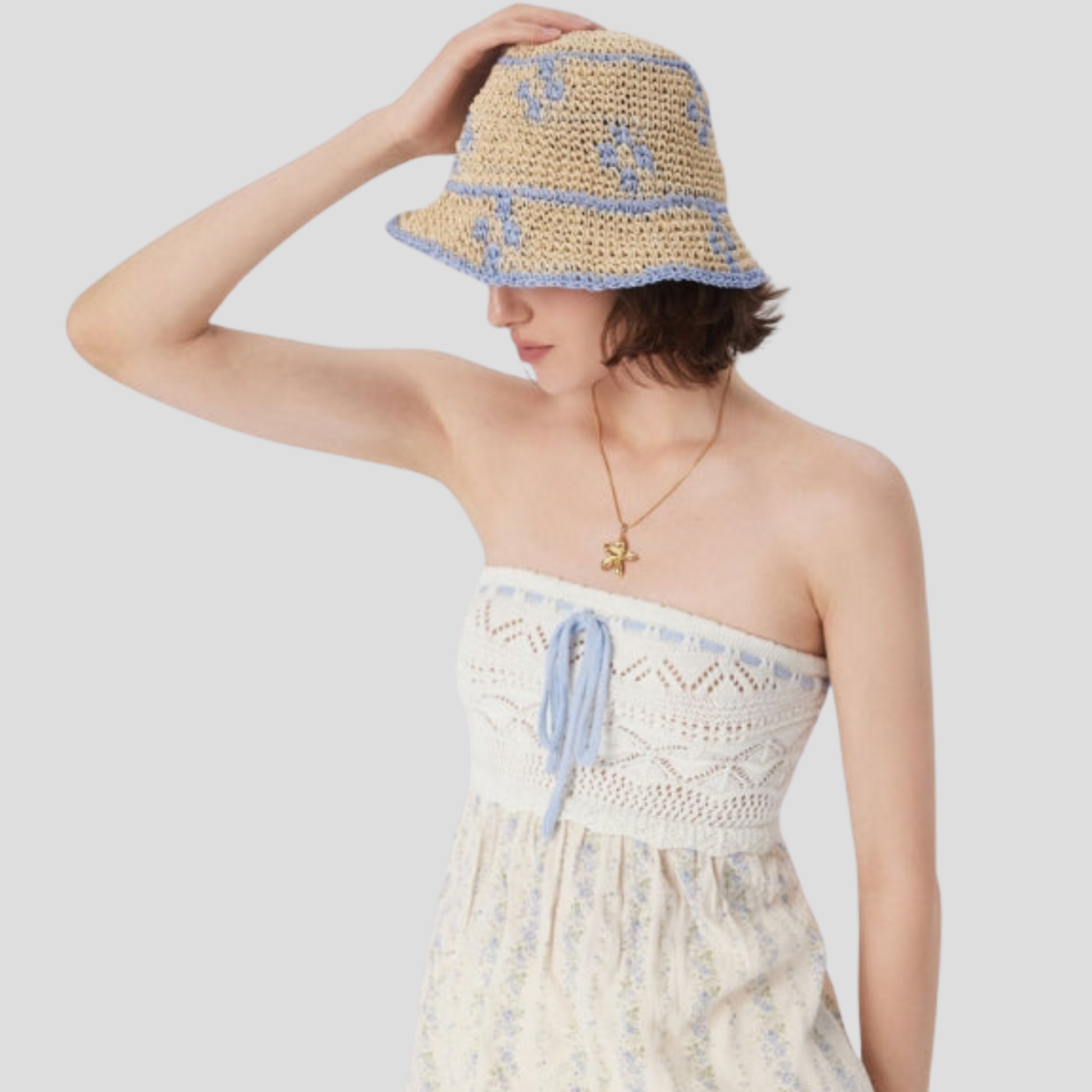 Beige two-tone woven bucket hat with a structured brim for women