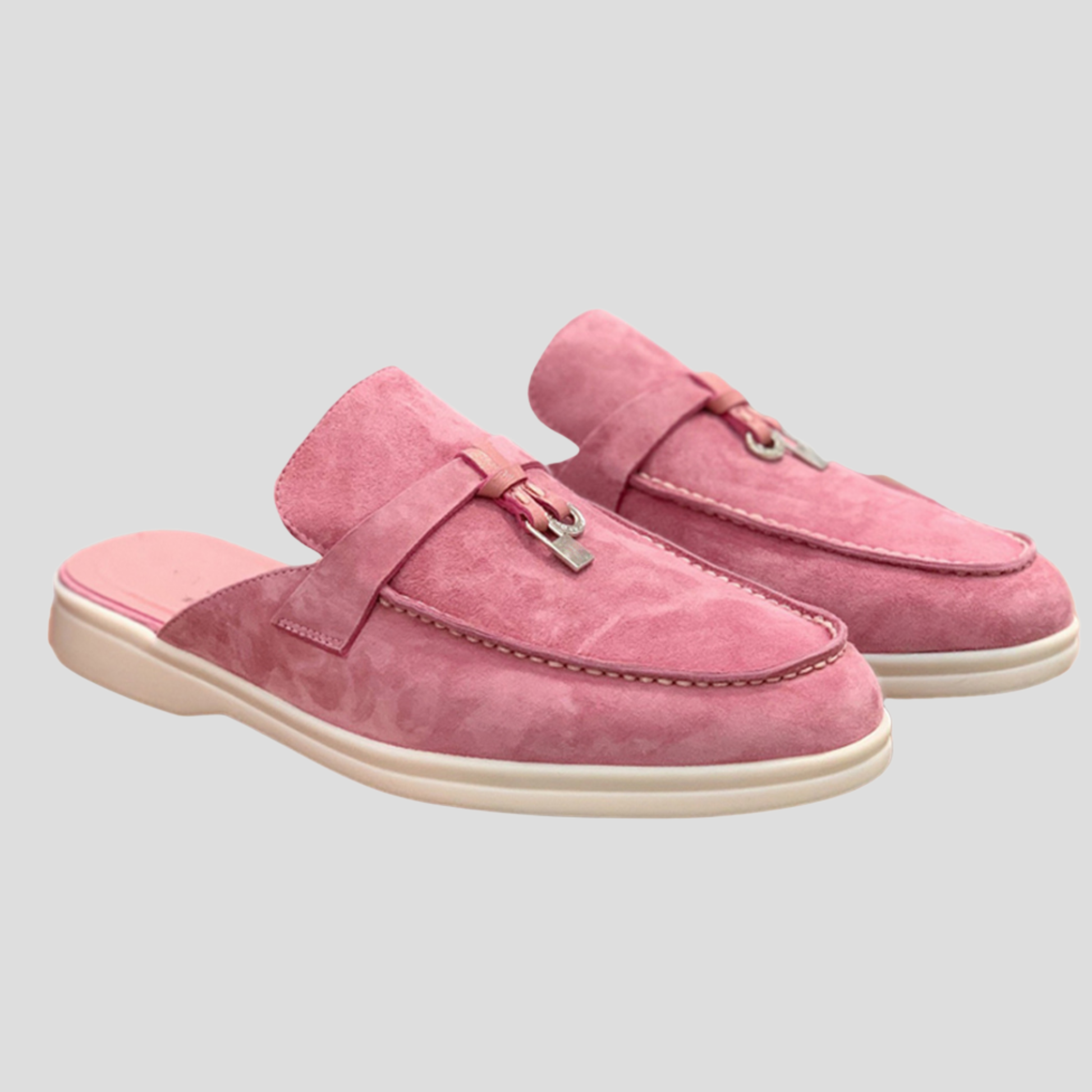 Women's backless loafer mules with tassel detail shown in multiple colors