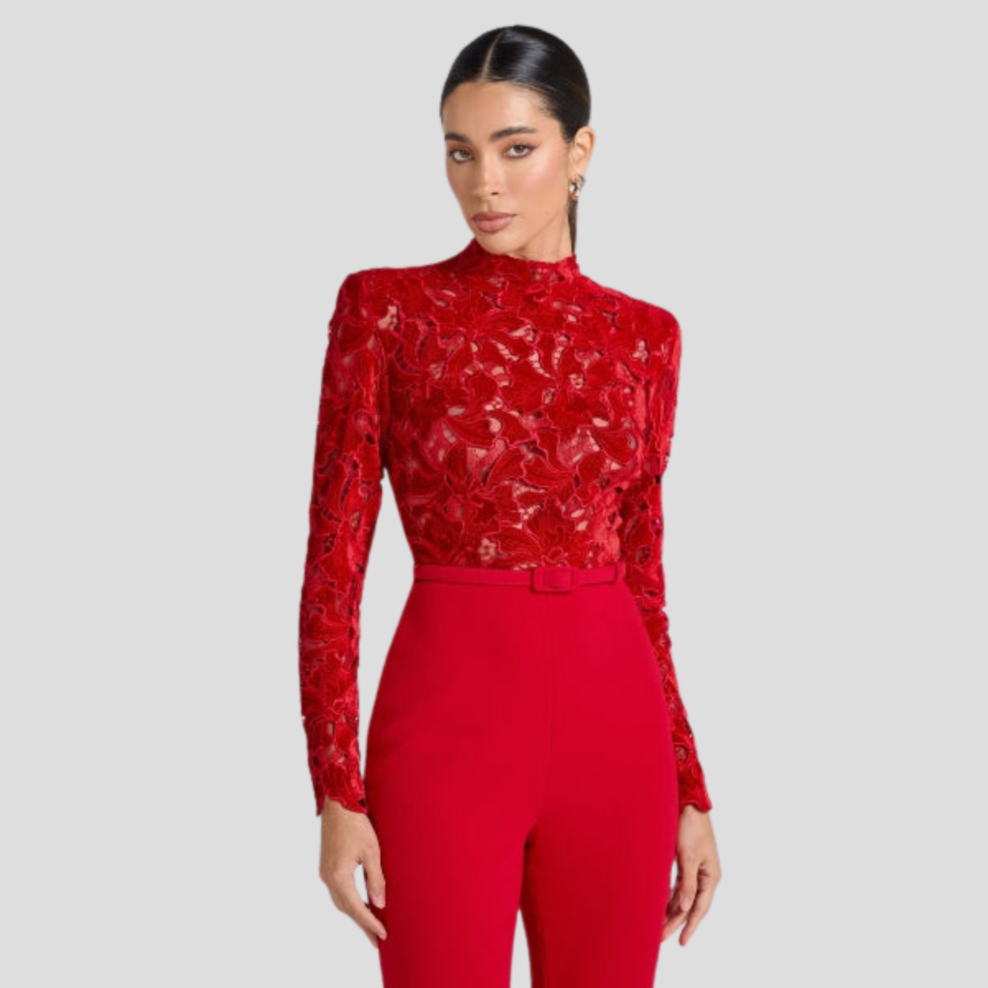 Red women's high-neck jumpsuit with belted waist and flared silhouette
