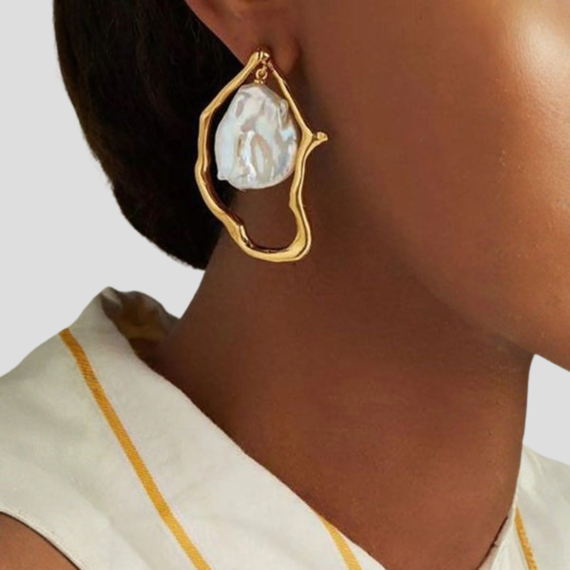 Gold-tone women's hoop earrings with organic open frame and bead charm detail