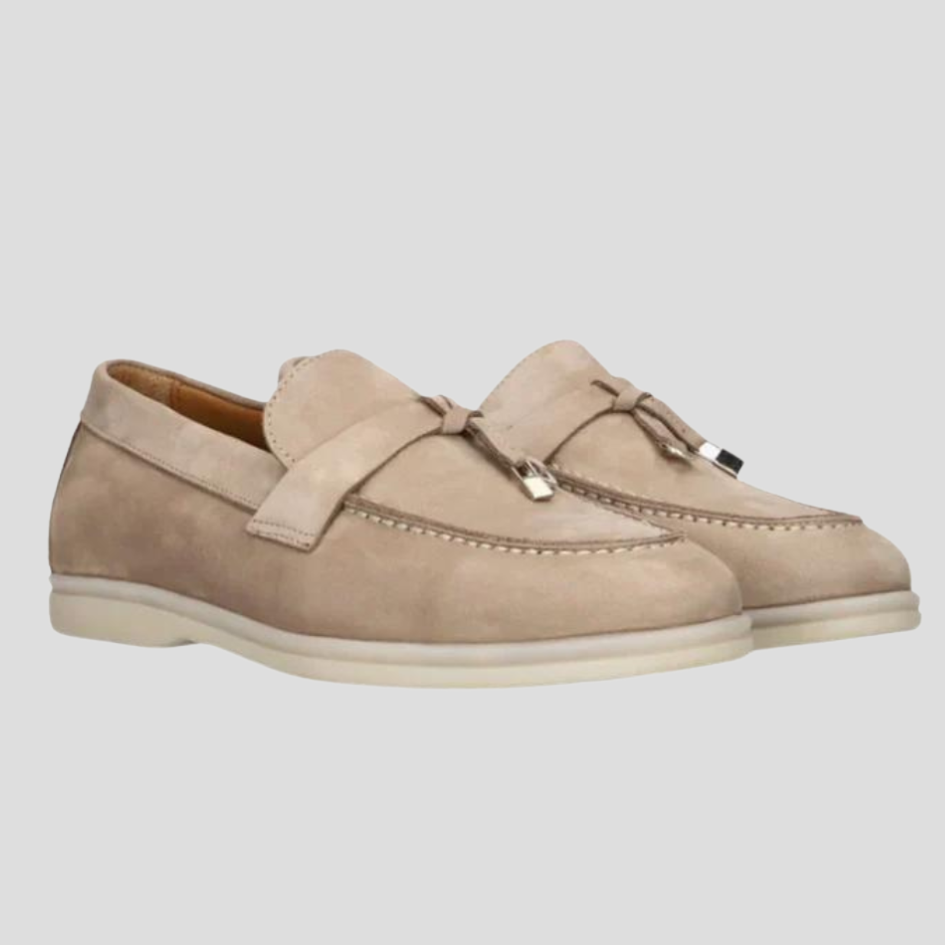 Women's tassel slip-on loafers with a clean silhouette, shown in a neutral colorway
