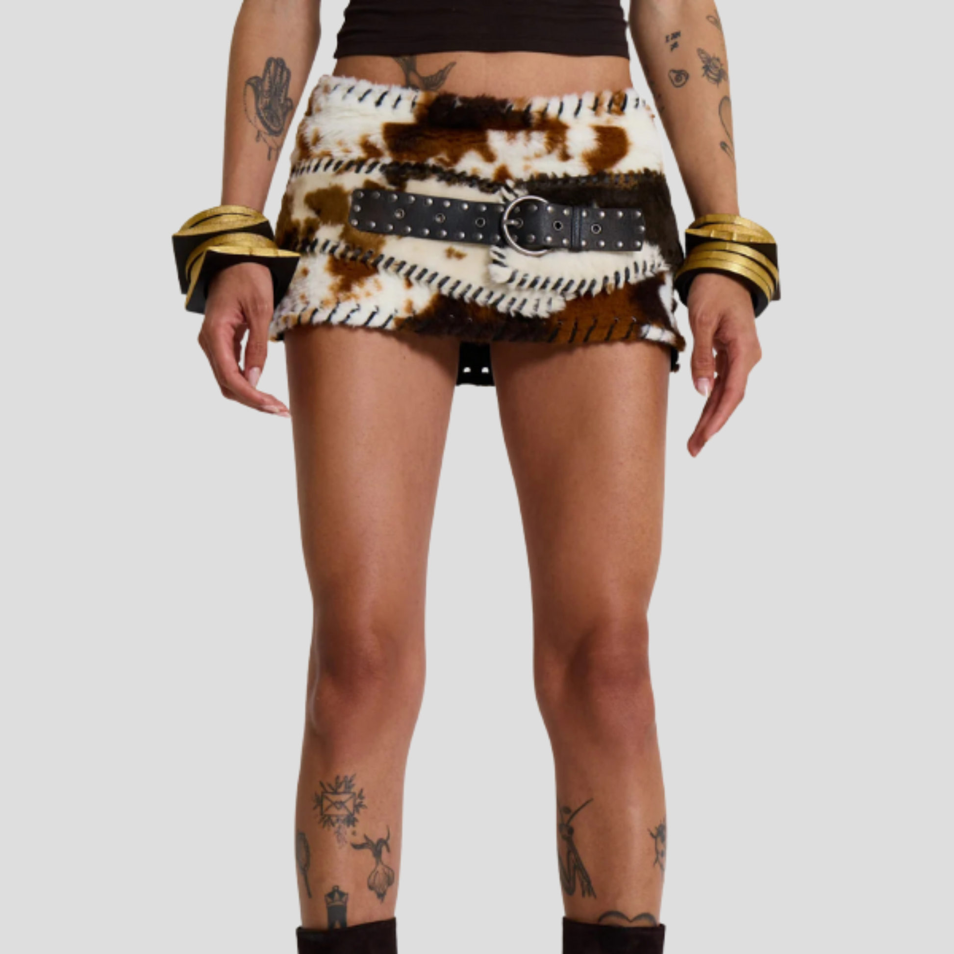 Brown cow print micro mini skirt with whipstitch edge detail