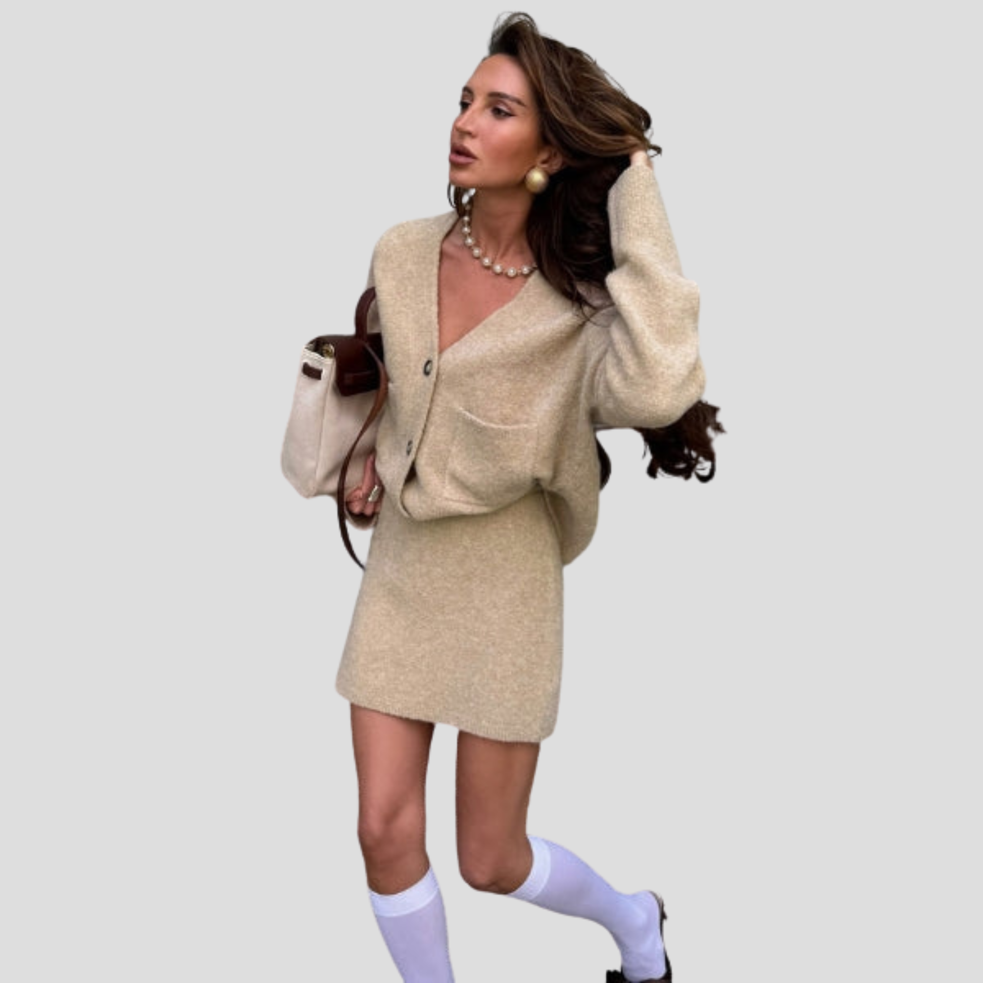 Beige women's two-piece set with V-neck cardigan and coordinated mini skirt