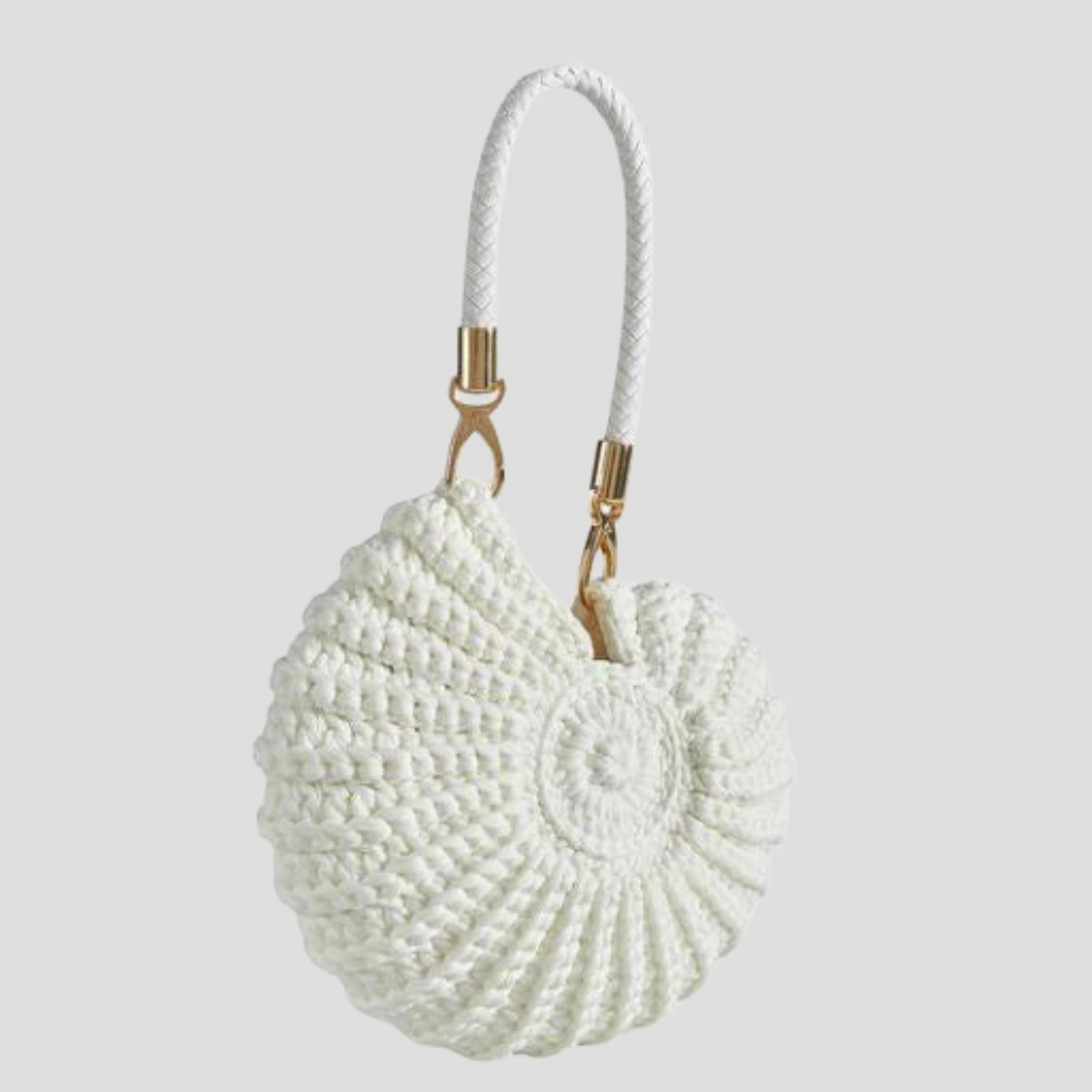Conch-shaped woven handbag with sculptural silhouette, shown in blue, black, and white