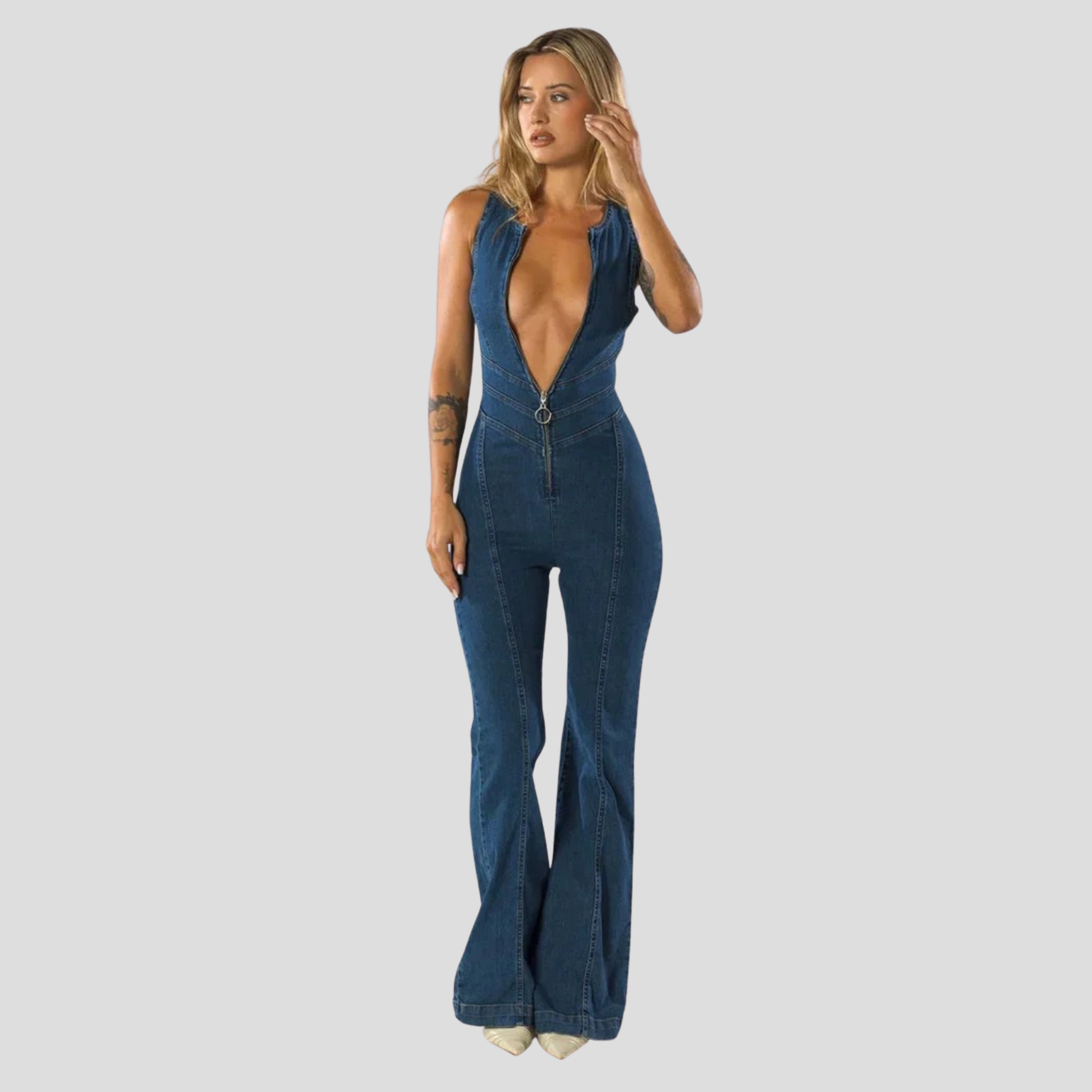 Blue women's jumpsuit with plunge neckline and open cutout back silhouette