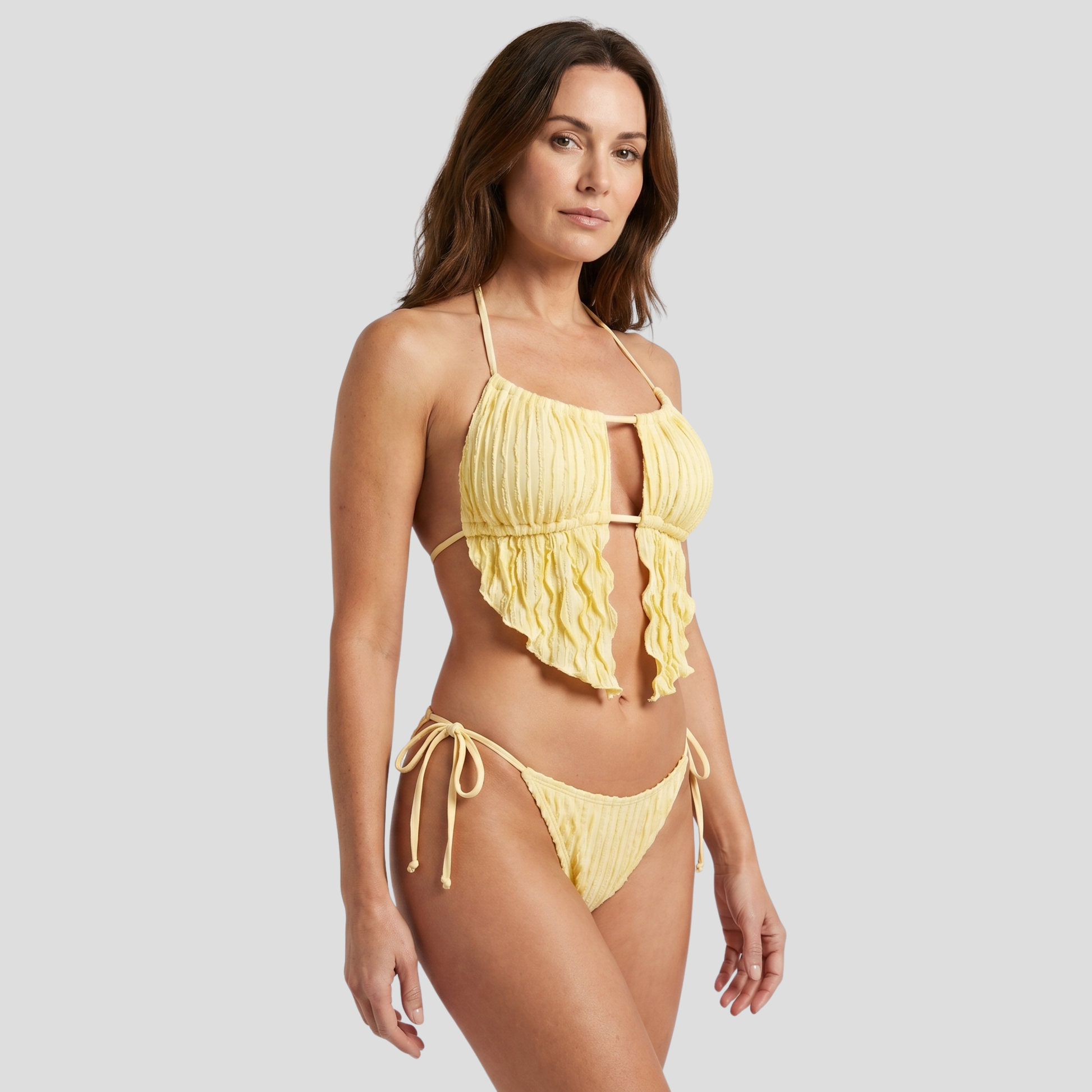Women's yellow two-piece bikini set with halter top and side-tie bottoms