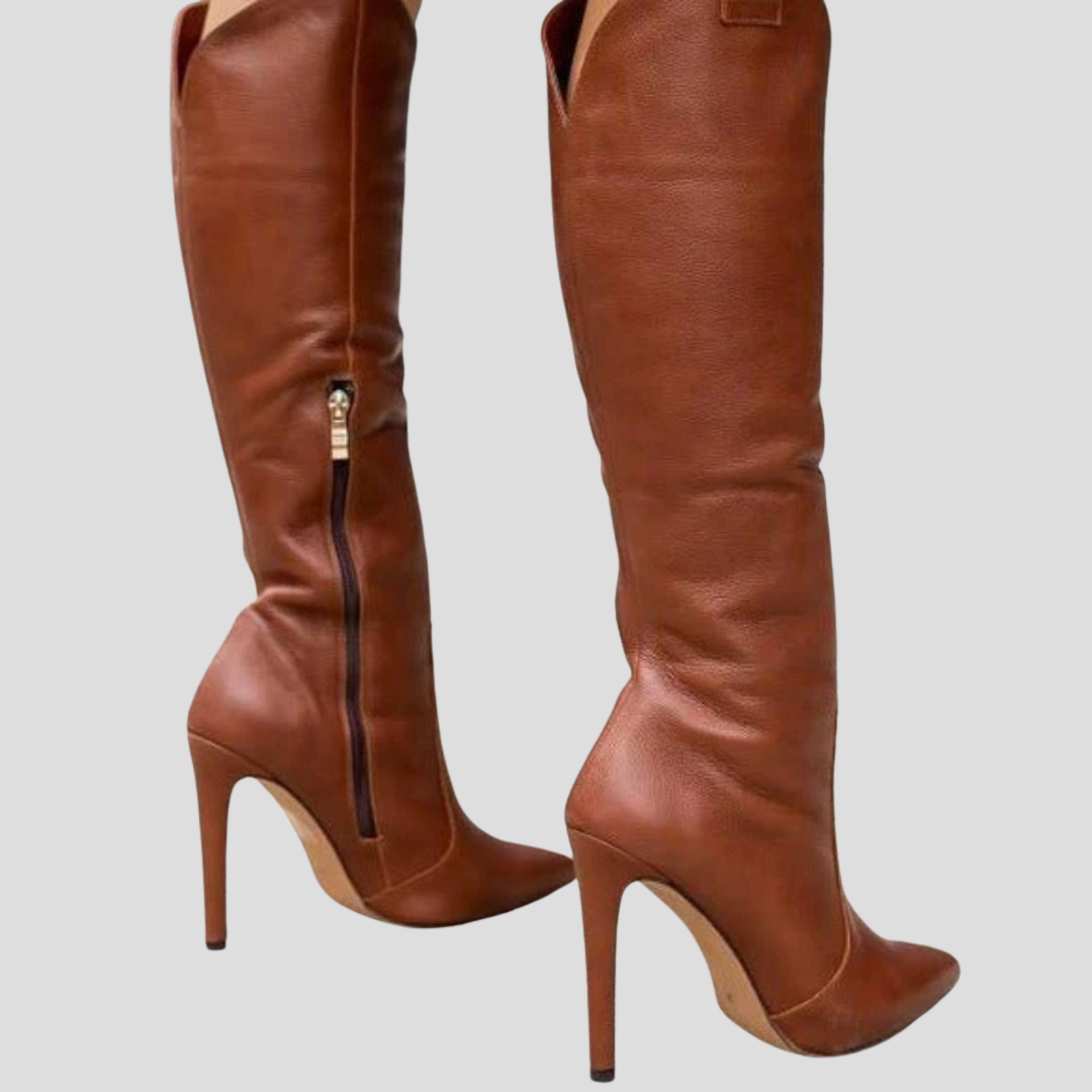 Knee-high pointed-toe women's boots with a slim heel and clean vertical silhouette