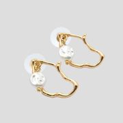 Gold-tone women's hoop earrings with organic open frame and bead charm detail