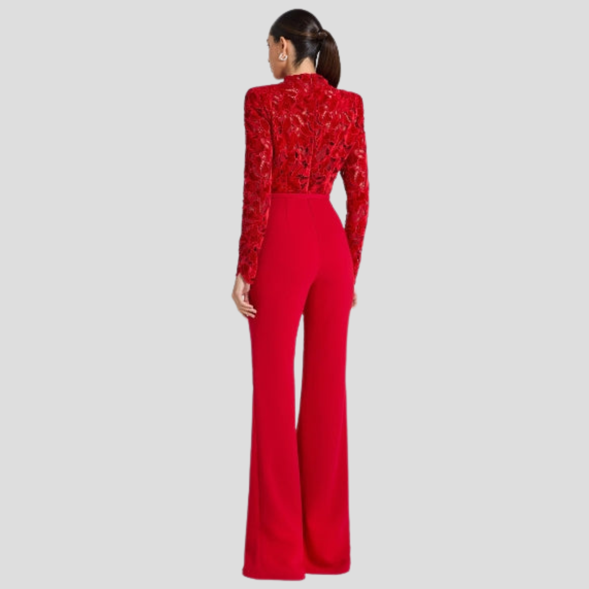 Red women's high-neck jumpsuit with belted waist and flared silhouette