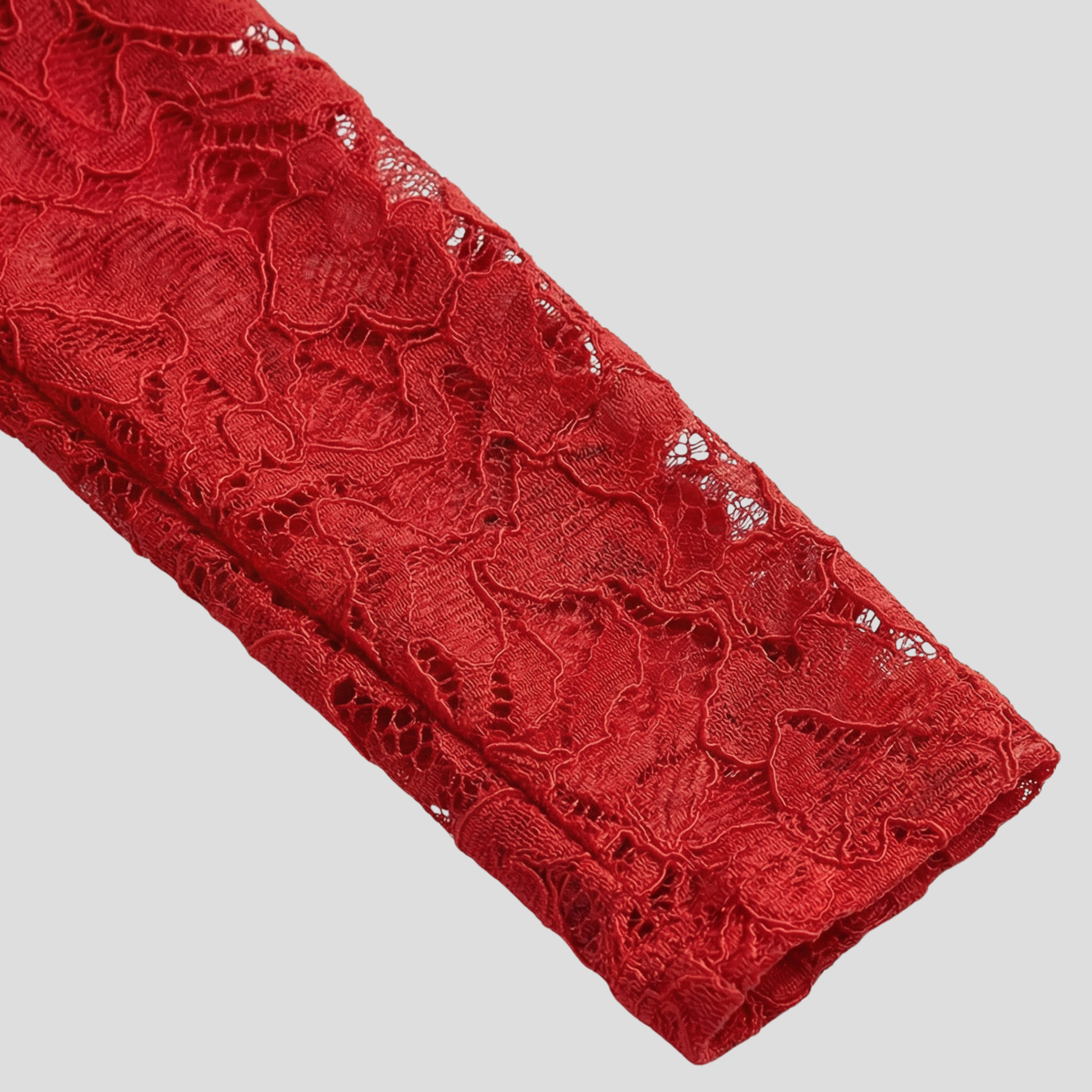 Red women's high-neck jumpsuit with belted waist and flared silhouette