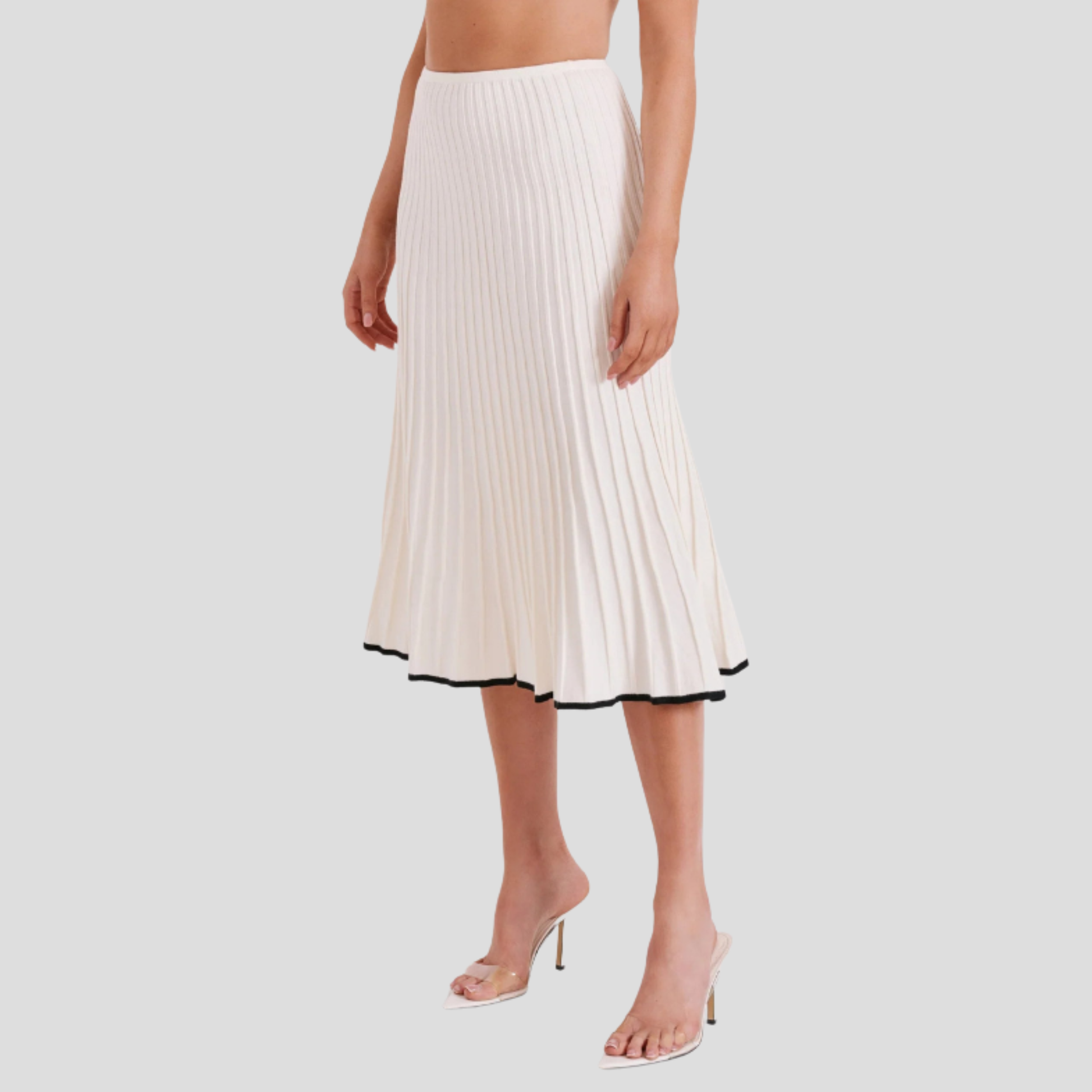 Ivory white two-piece set with cropped button-front top and pleated skirt