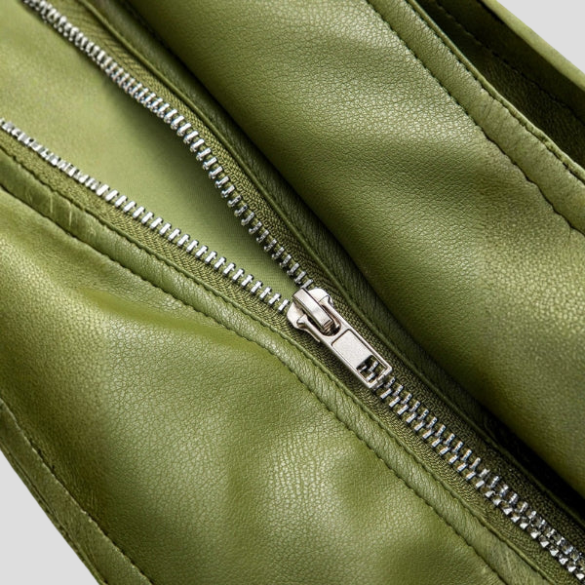 Green women's cropped bomber jacket with structured silhouette and ribbed hem