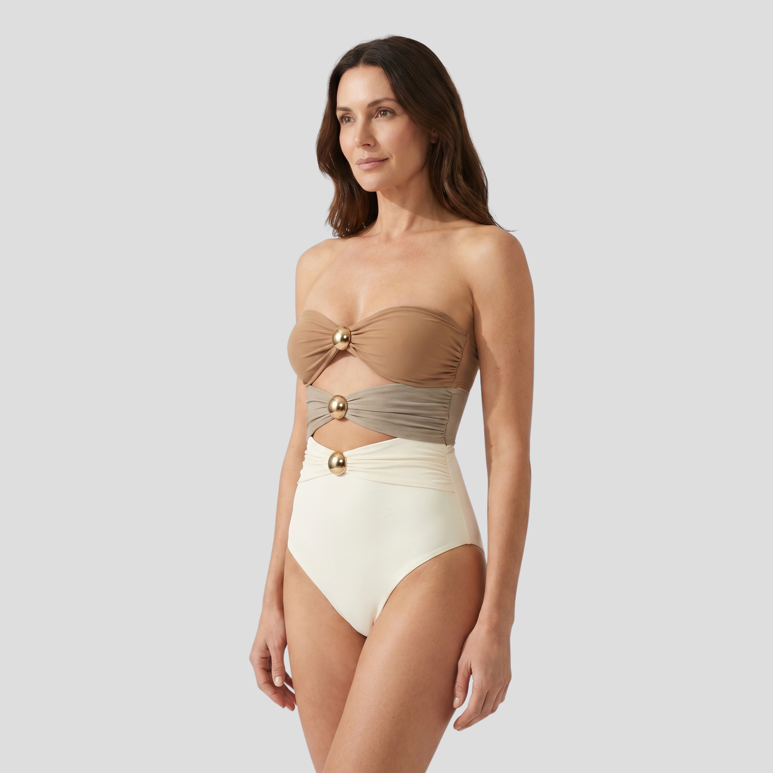 White bandeau one-piece swimsuit with cut-out waist detail and metallic accents