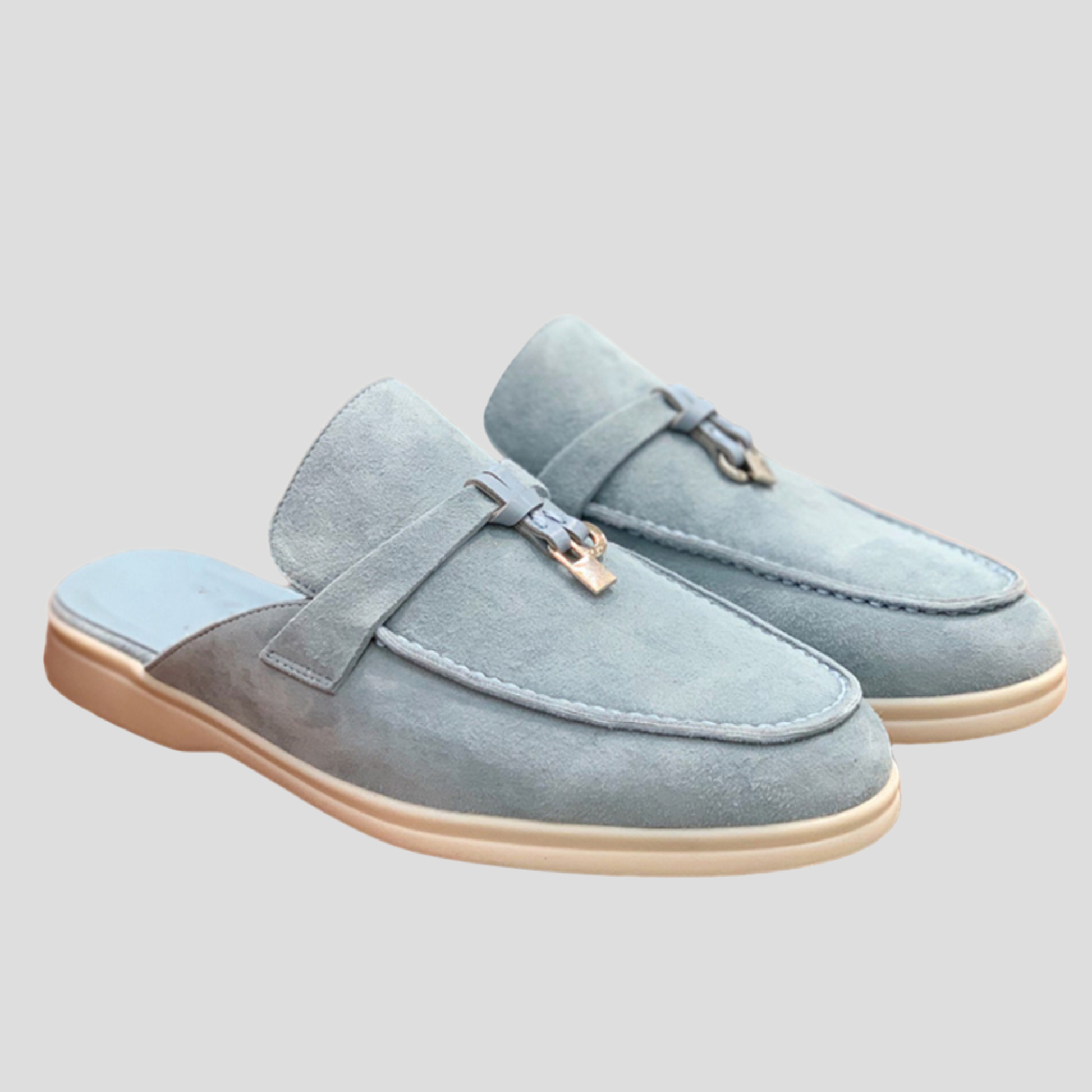 Women's backless loafer mules with tassel detail shown in multiple colors