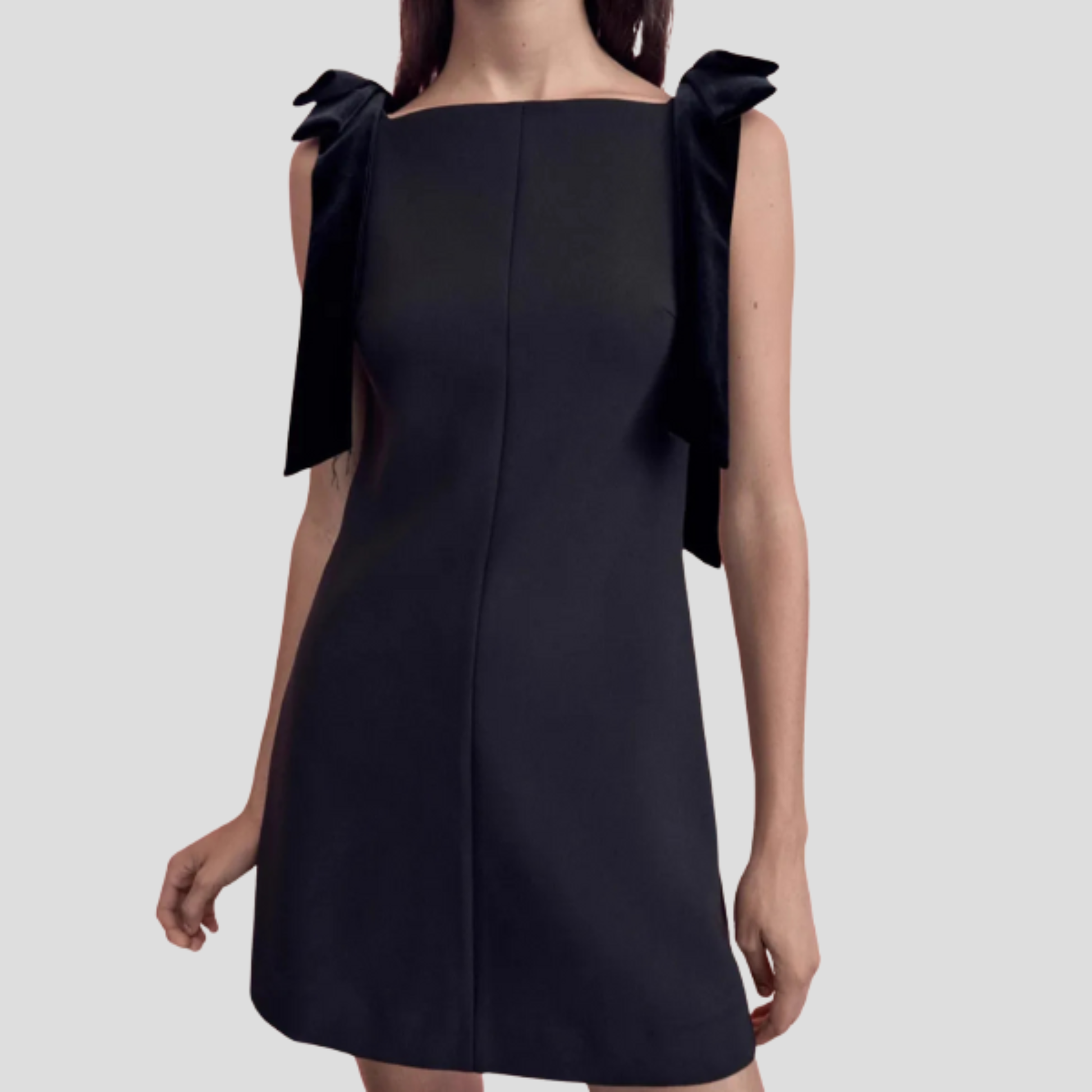 Black bow strap mini dress with A-line silhouette for evening wear