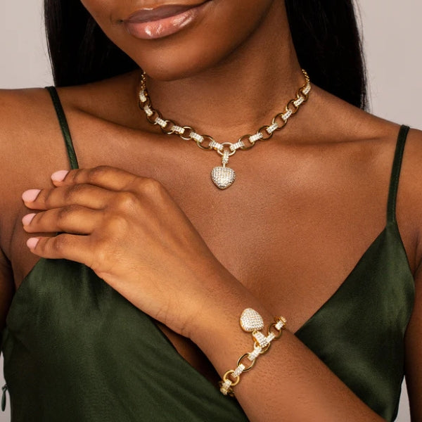 Women's jewelry set with oval chain and pavé heart pendant in gold and silver