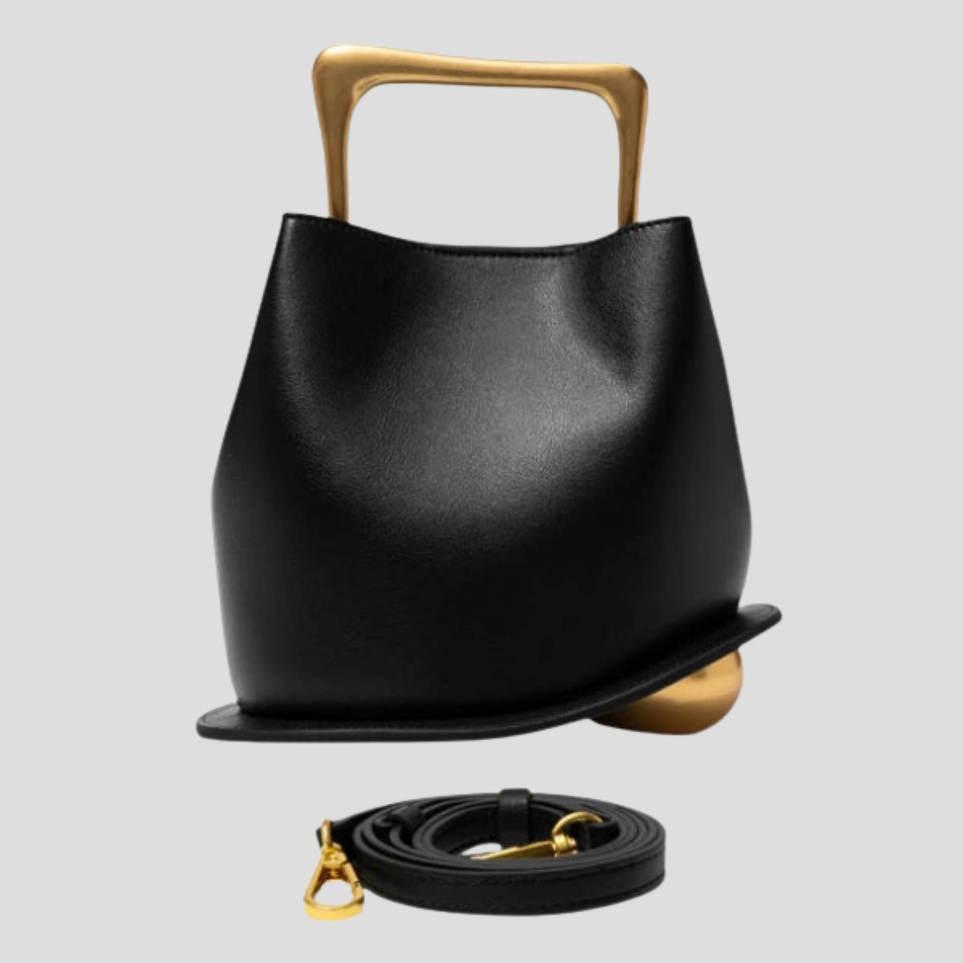 Rounded mini handbag with sculpted handle shown in neutral colorways