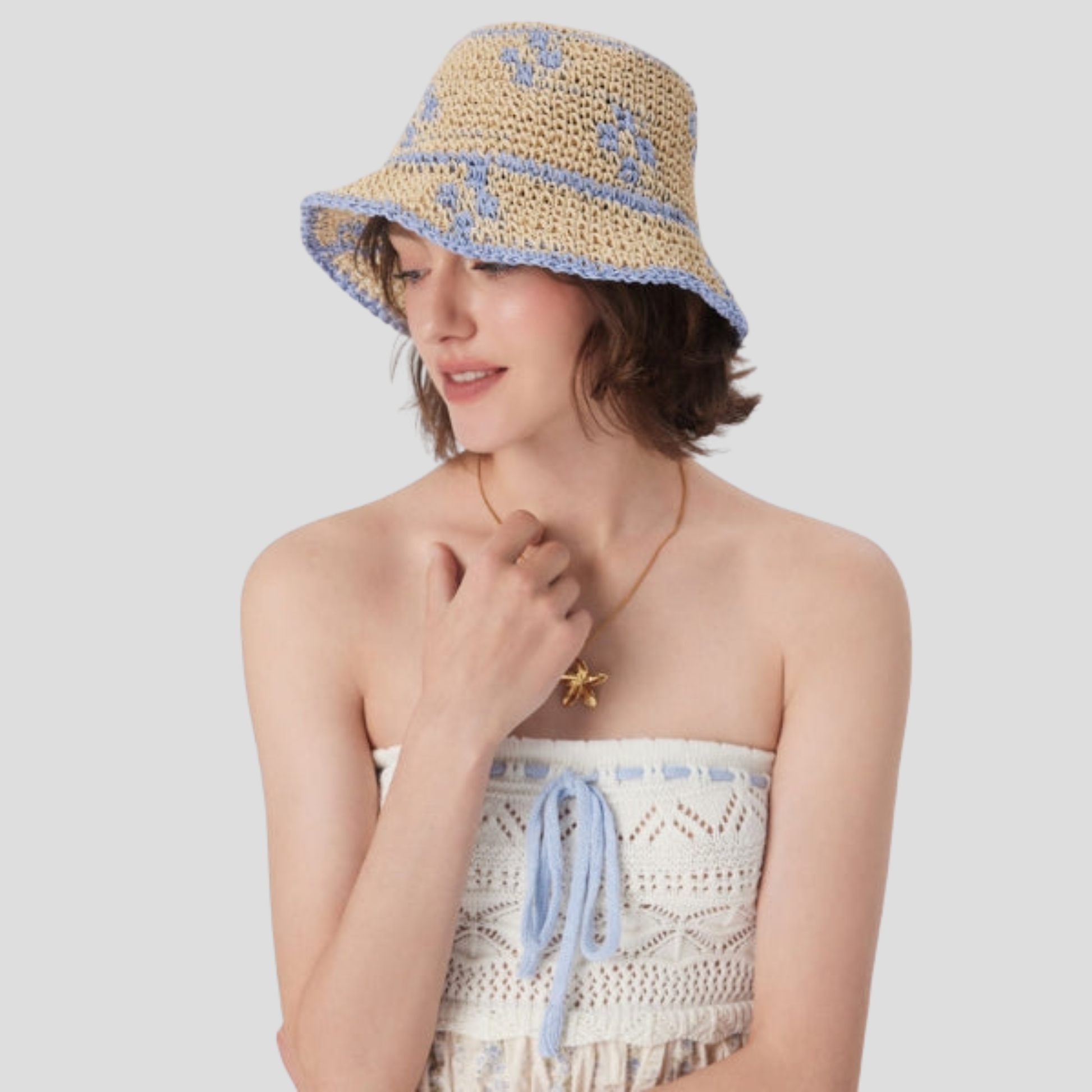 Beige two-tone woven bucket hat with a structured brim for women