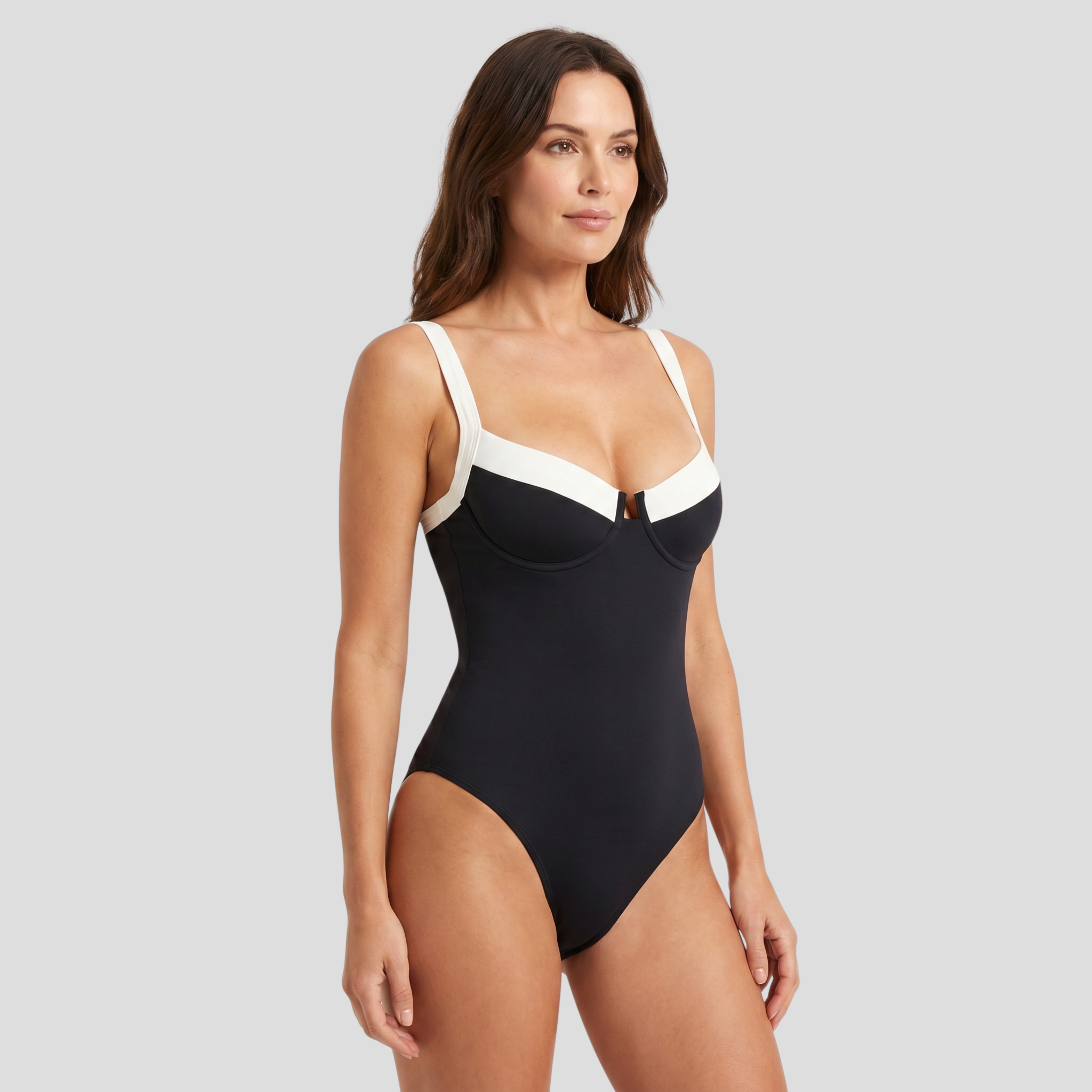 Black one-piece women's swimsuit with contrast trim and sculpted neckline