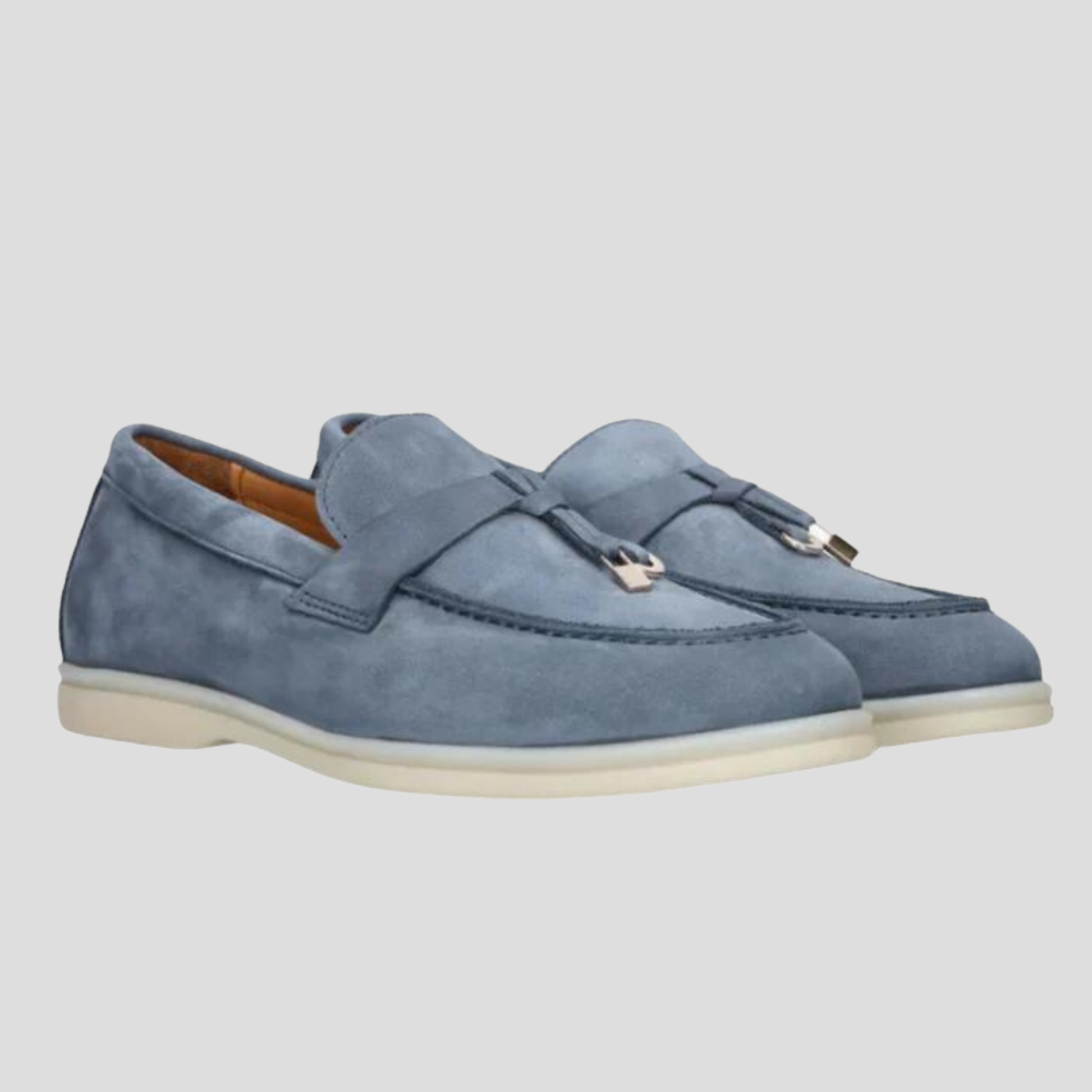 Women's tassel slip-on loafers with a clean silhouette, shown in a neutral colorway