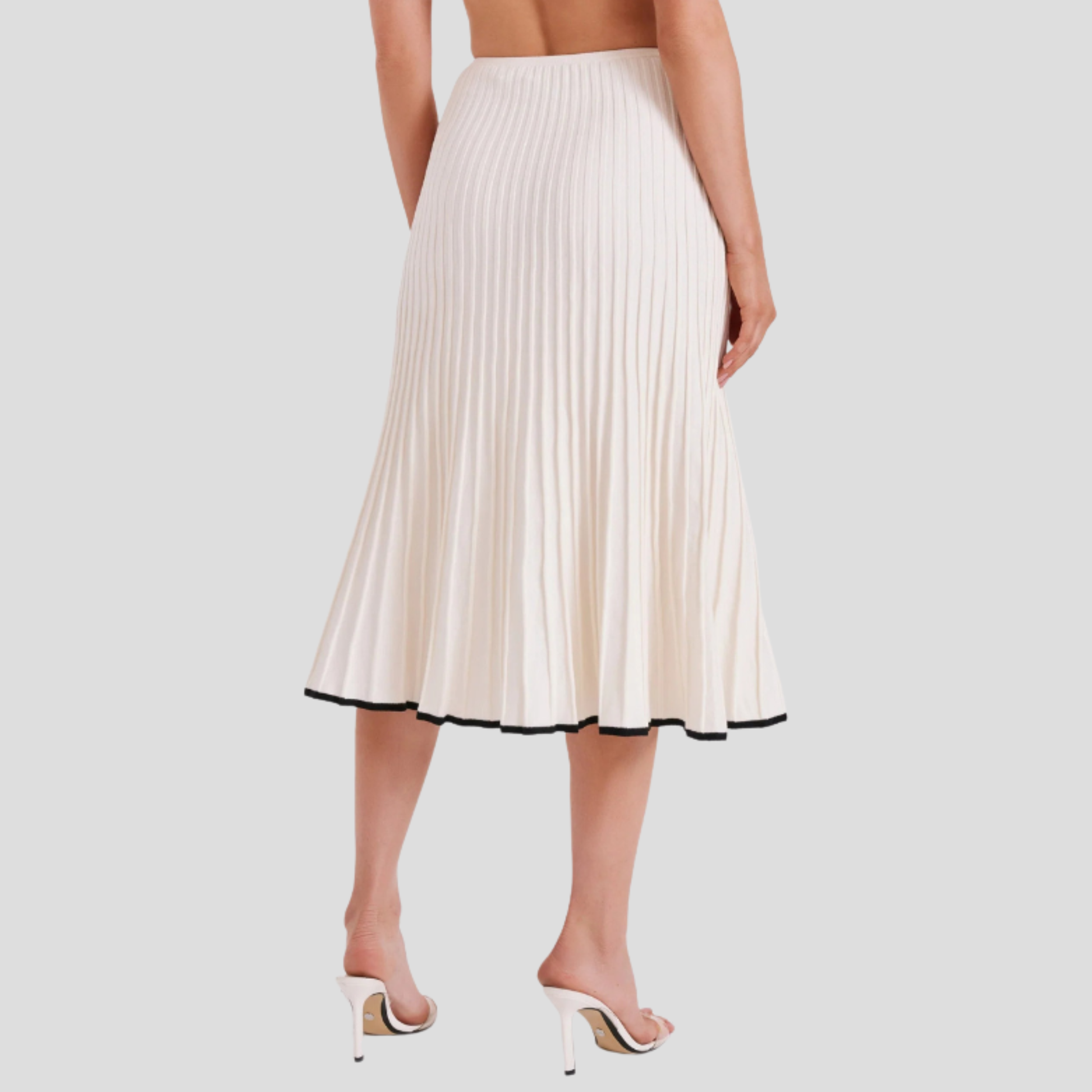 Ivory white two-piece set with cropped button-front top and pleated skirt