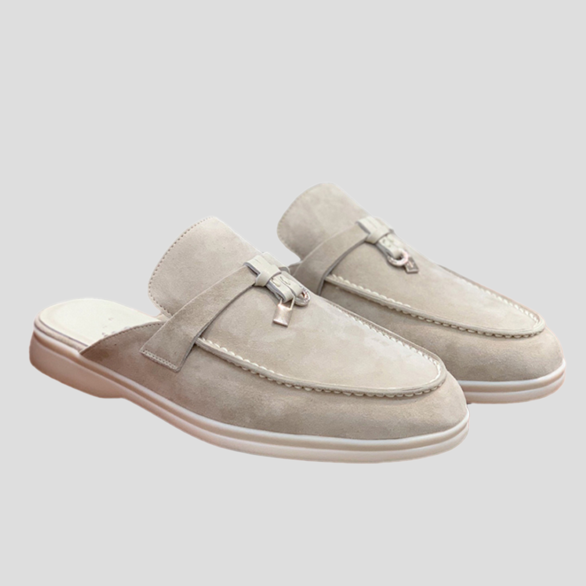 Women's backless loafer mules with tassel detail shown in multiple colors