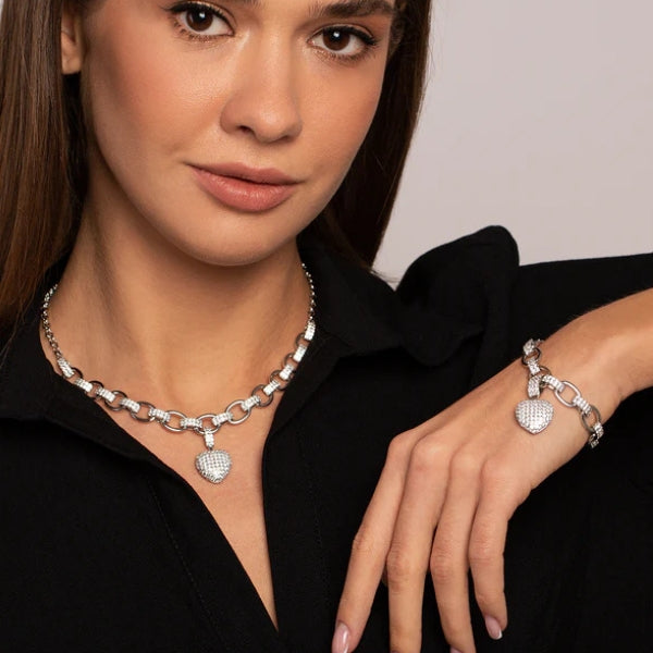 Women's jewelry set with oval chain and pavé heart pendant in gold and silver