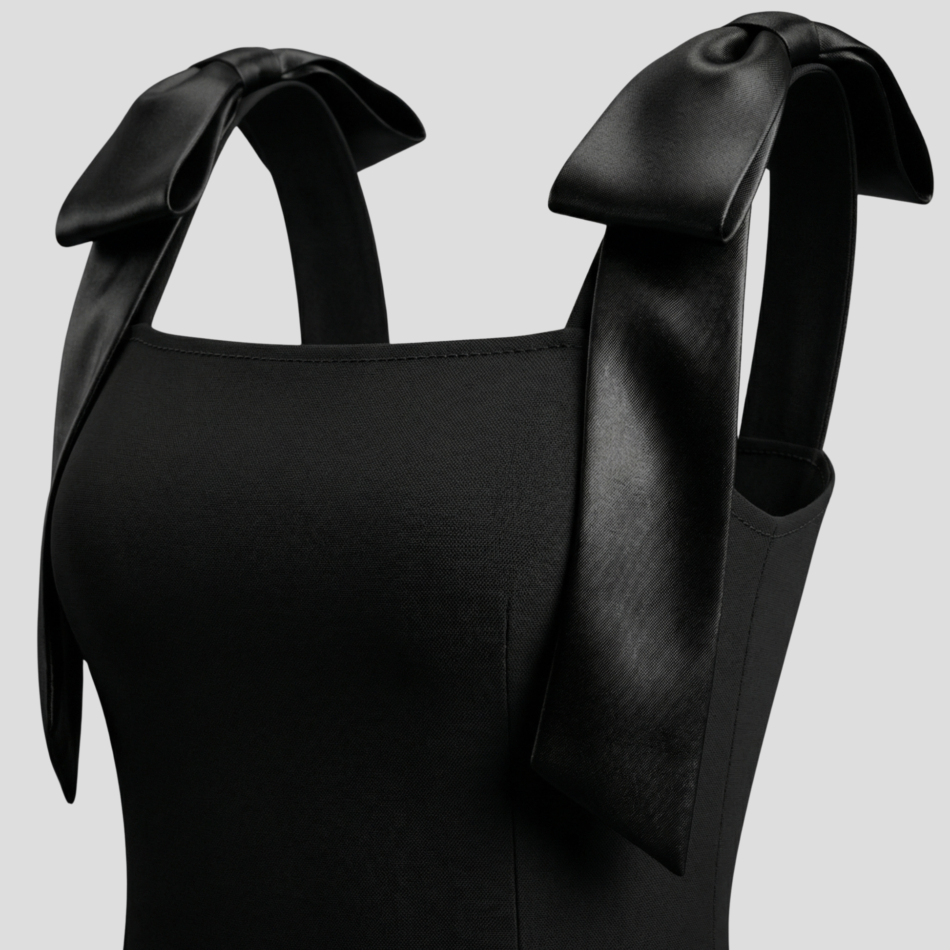 Black bow strap mini dress with A-line silhouette for evening wear