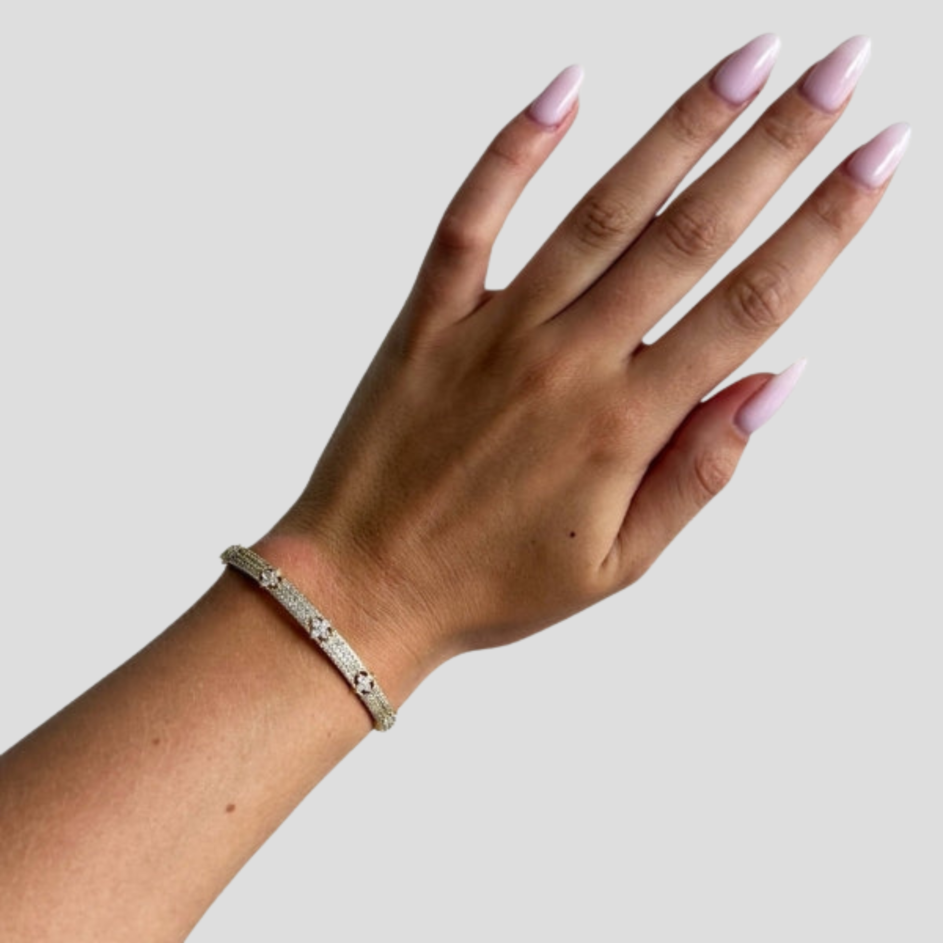 Hinged women's cuff bracelet with pavé panel detail in gold and silver tones