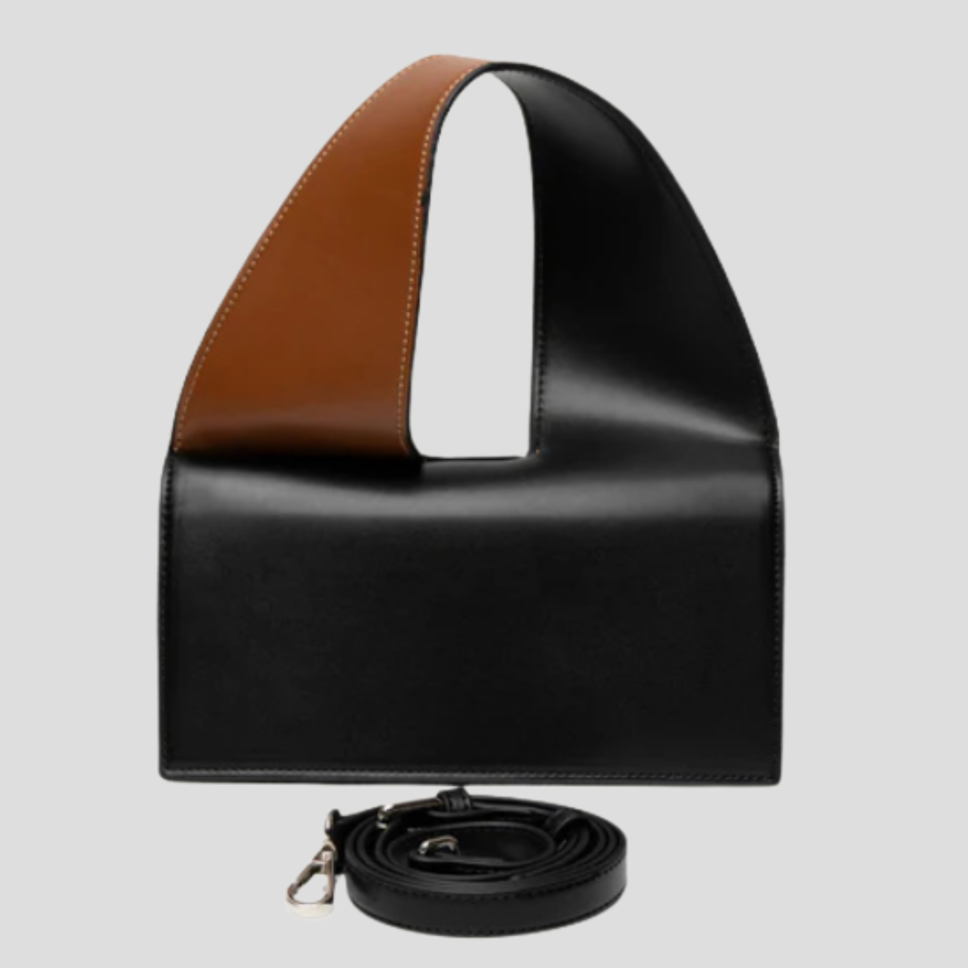 Black structured women's handbag with two-tone handle detail for daily wear