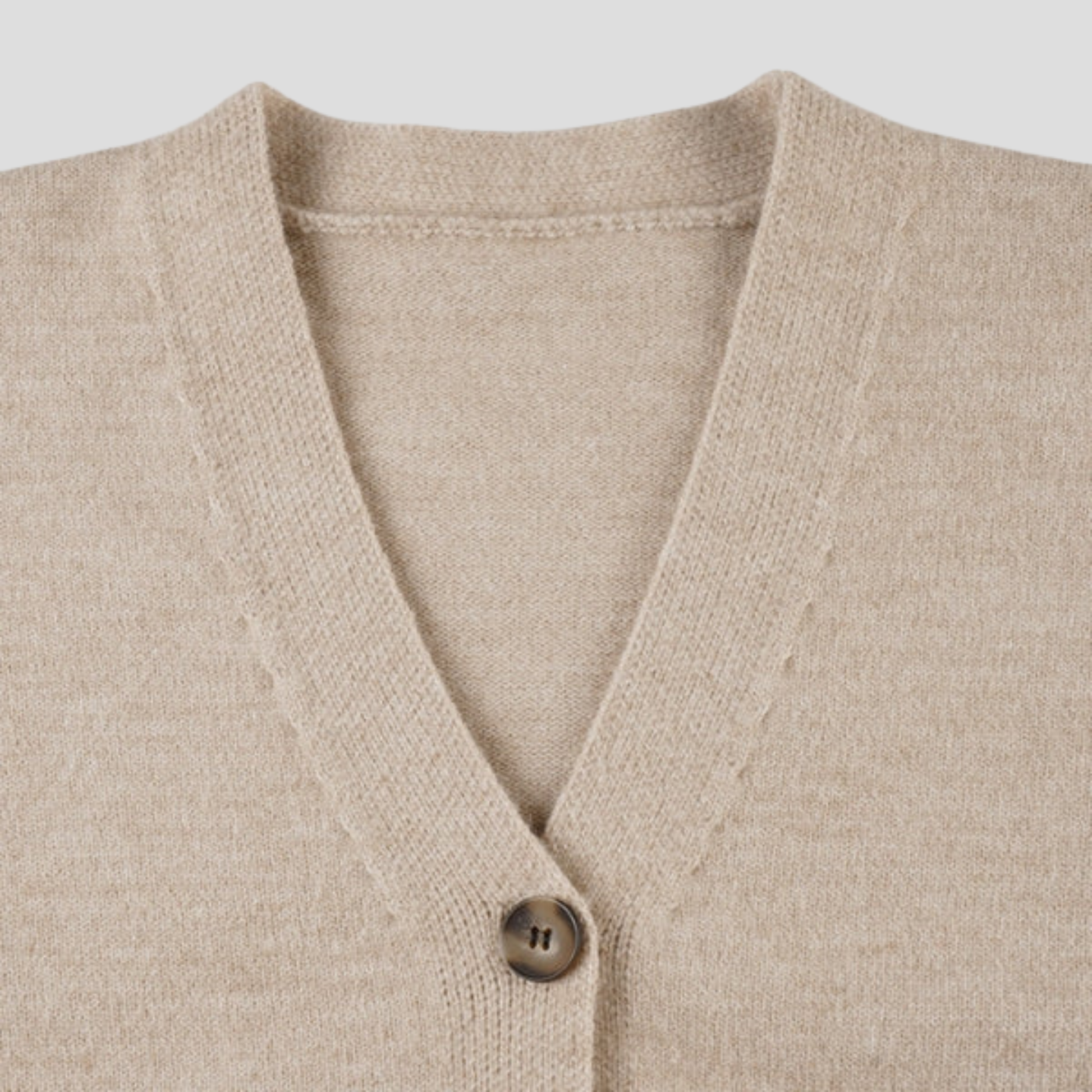 Beige women's two-piece set with V-neck cardigan and coordinated mini skirt