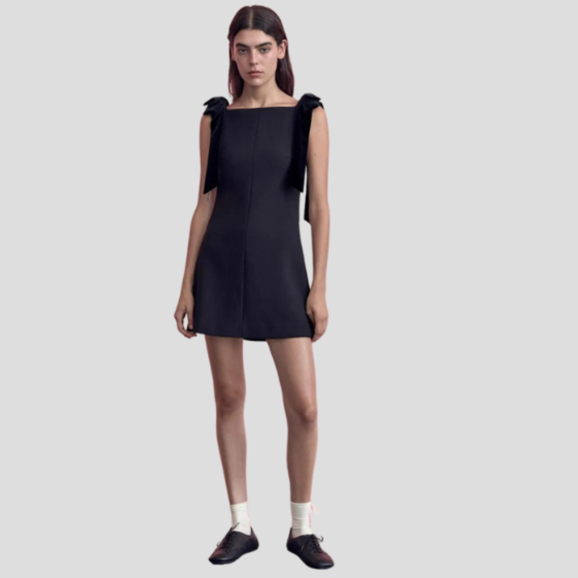 Black bow strap mini dress with A-line silhouette for evening wear