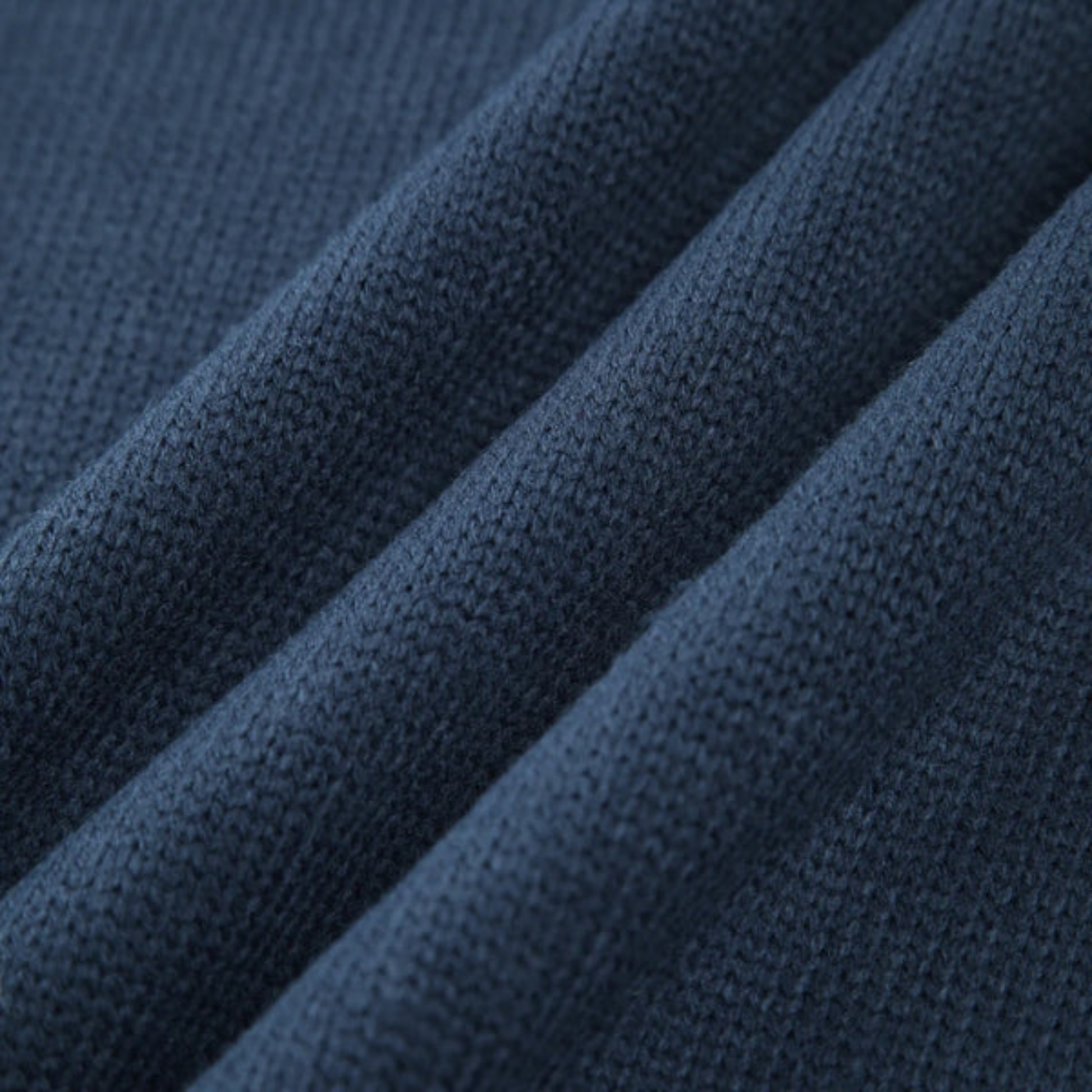 Navy blue ribbed high neck sweater with relaxed silhouette and extended cuffs