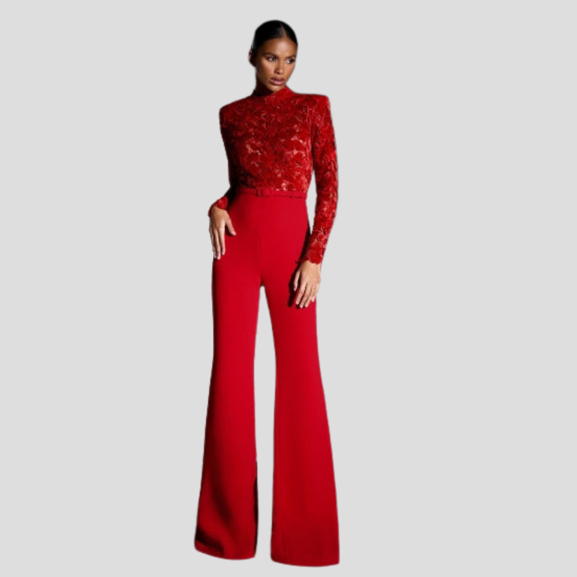 Red women's high-neck jumpsuit with belted waist and flared silhouette