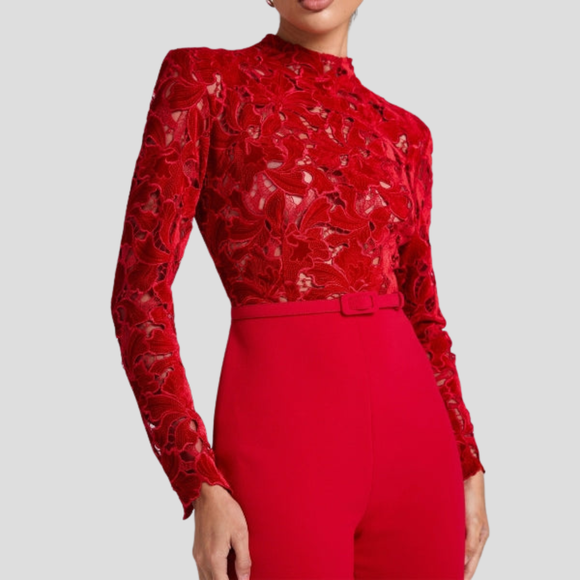 Red women's high-neck jumpsuit with belted waist and flared silhouette