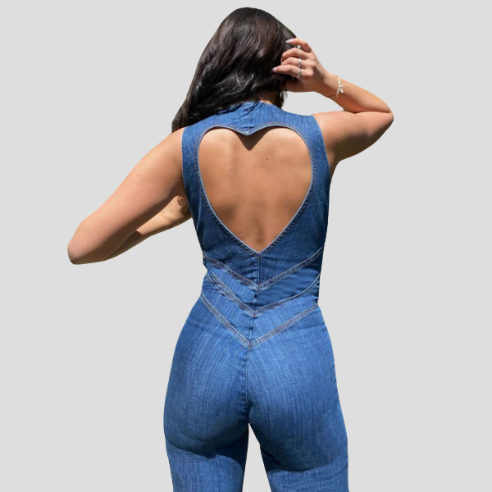 Blue women's jumpsuit with plunge neckline and open cutout back silhouette