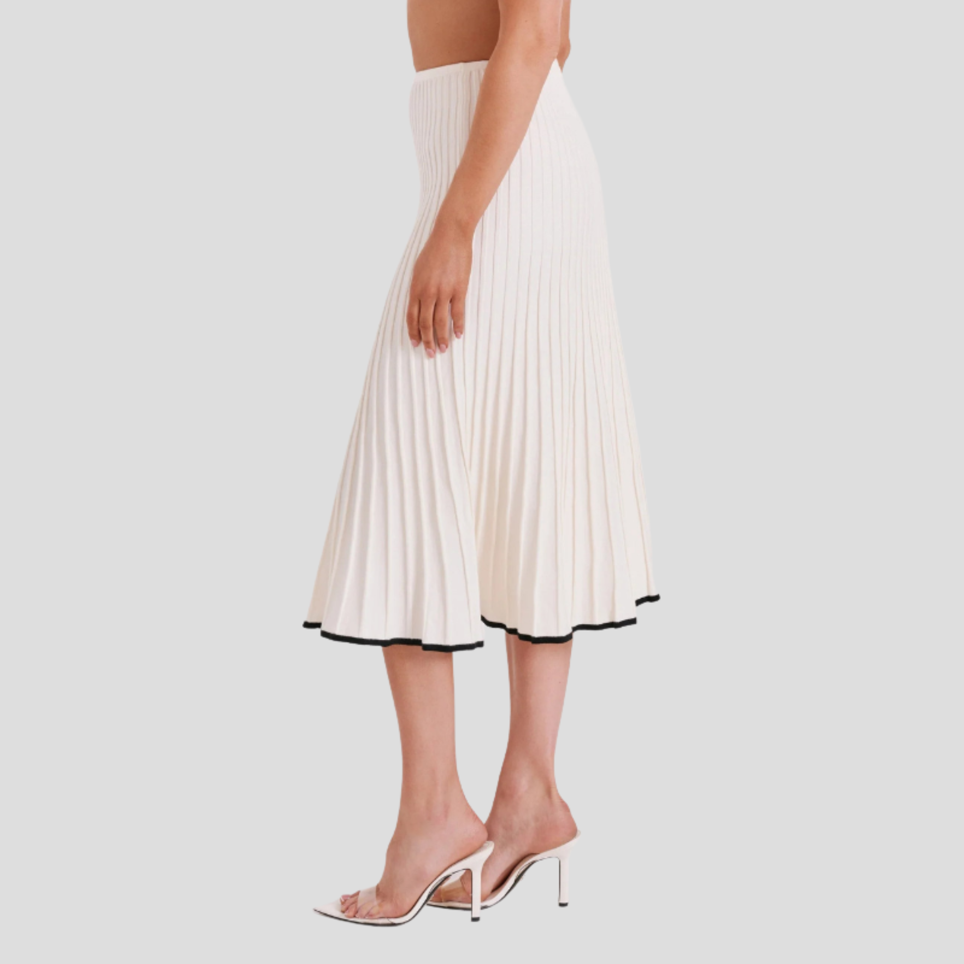 Ivory white two-piece set with cropped button-front top and pleated skirt