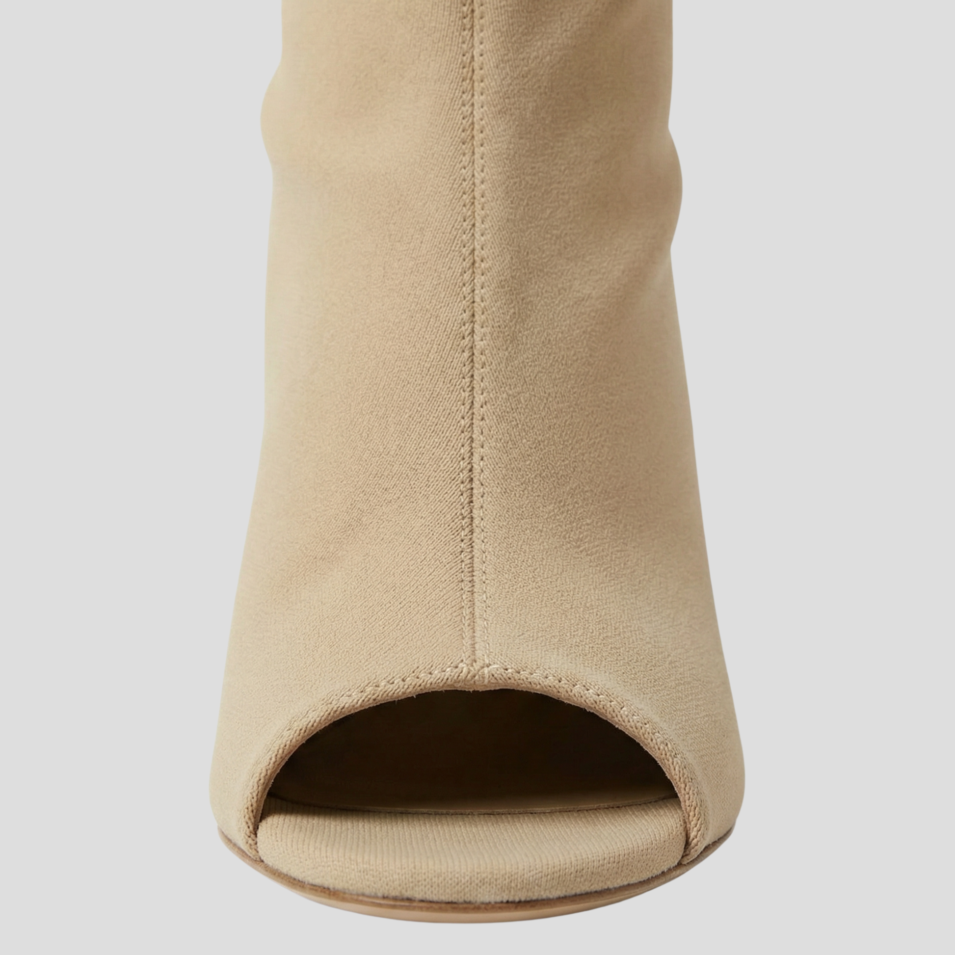 Women's open-toe knee-high boots with a clean vertical structure, shown in a neutral tone