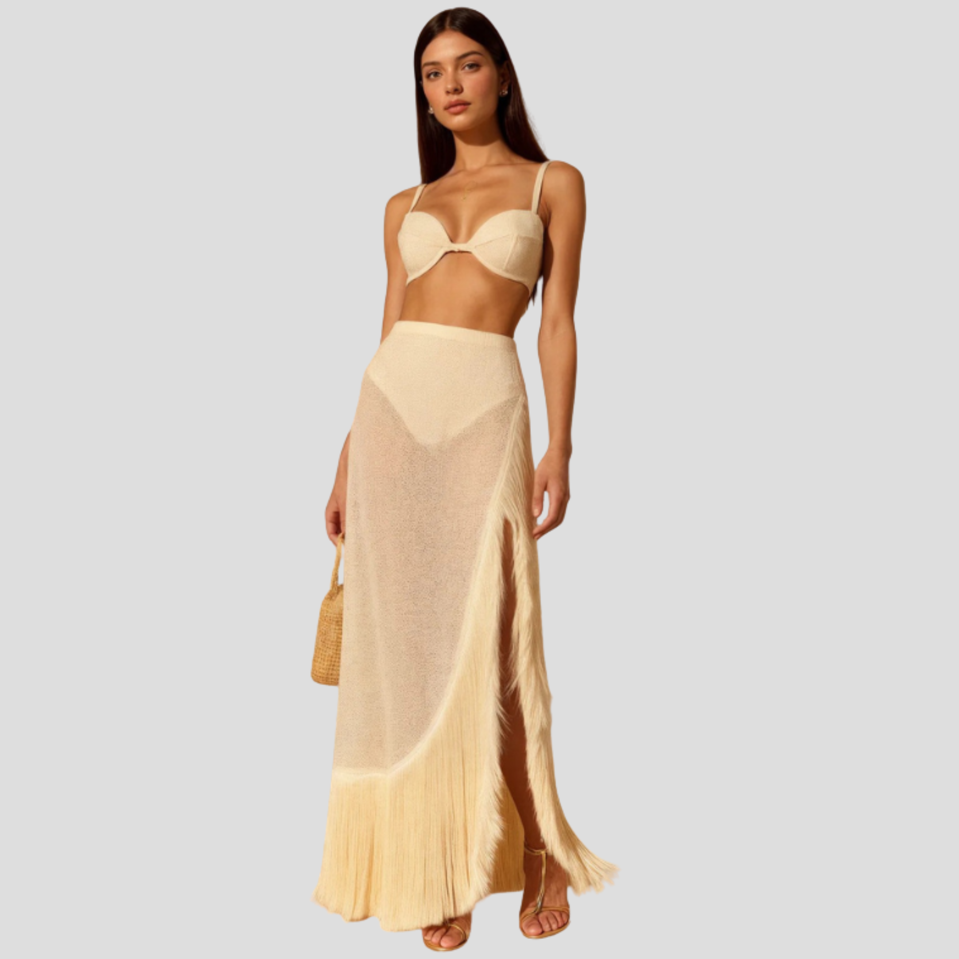 White two-piece set with fitted bralette top and flowing fringe maxi skirt for occasion wear