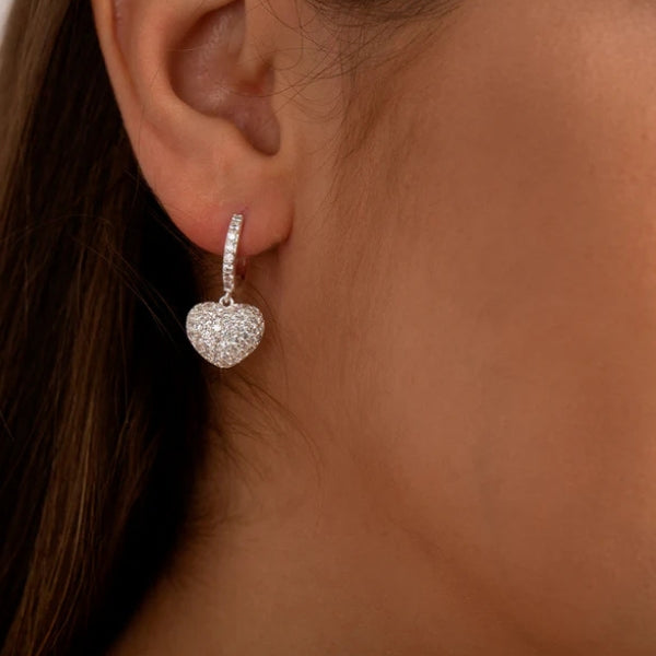 Heart charm pavé drop earrings shown in gold and silver finishes
