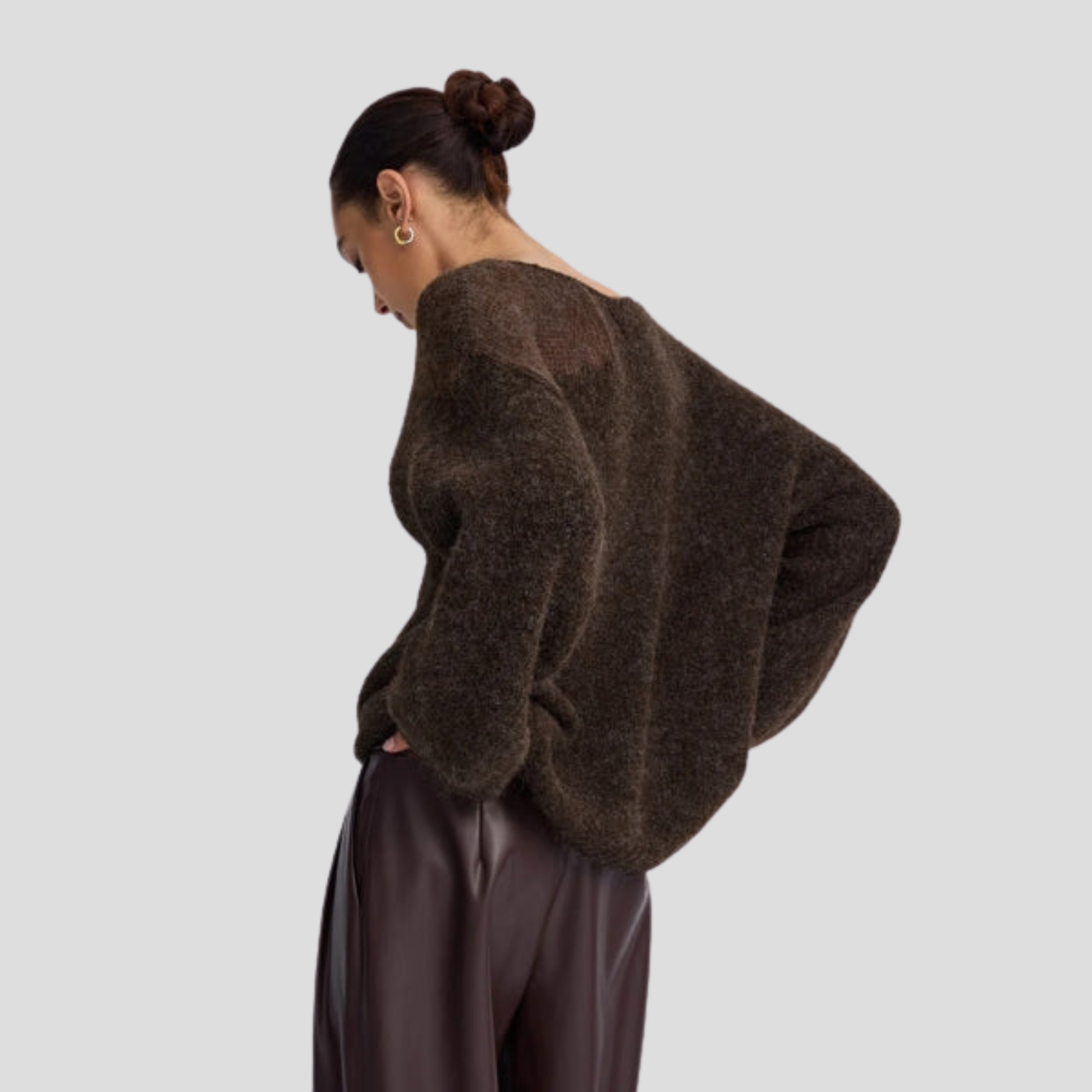 Brown women's boat neck sweater with relaxed draped silhouette and long sleeves