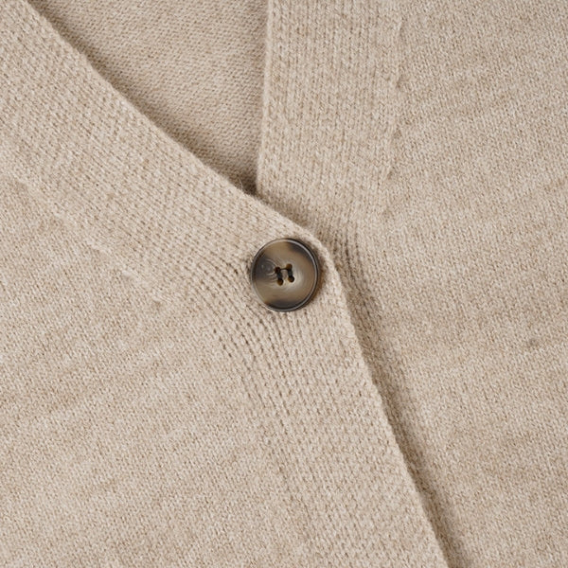 Beige women's two-piece set with V-neck cardigan and coordinated mini skirt