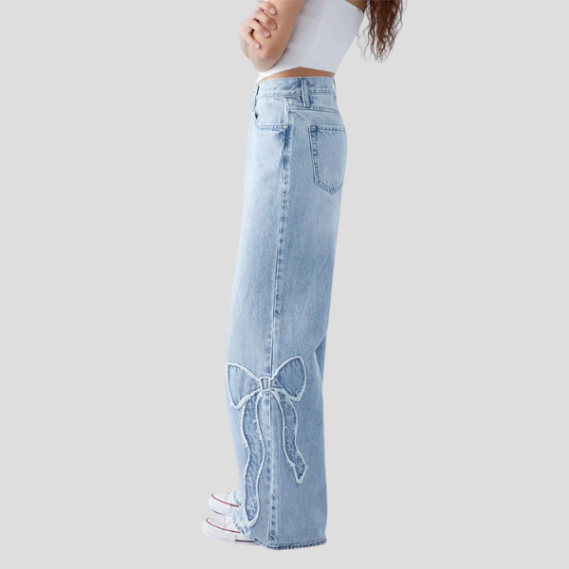Women's relaxed-fit blue jeans with feminine side bow detail