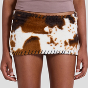 Brown cow print micro mini skirt with whipstitch edge detail