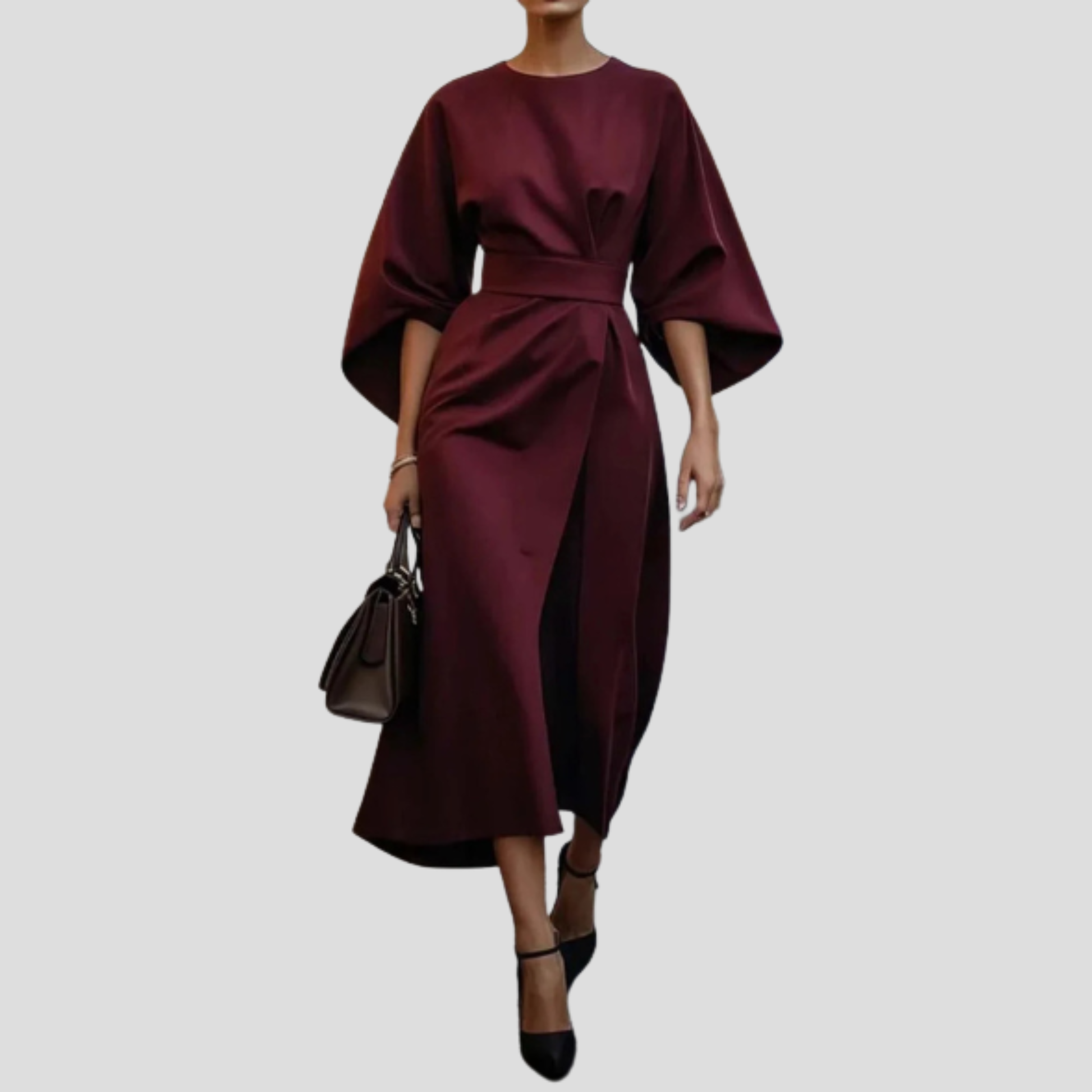 Women's belted floor-length maxi dress with a flowing skirt and defined waist