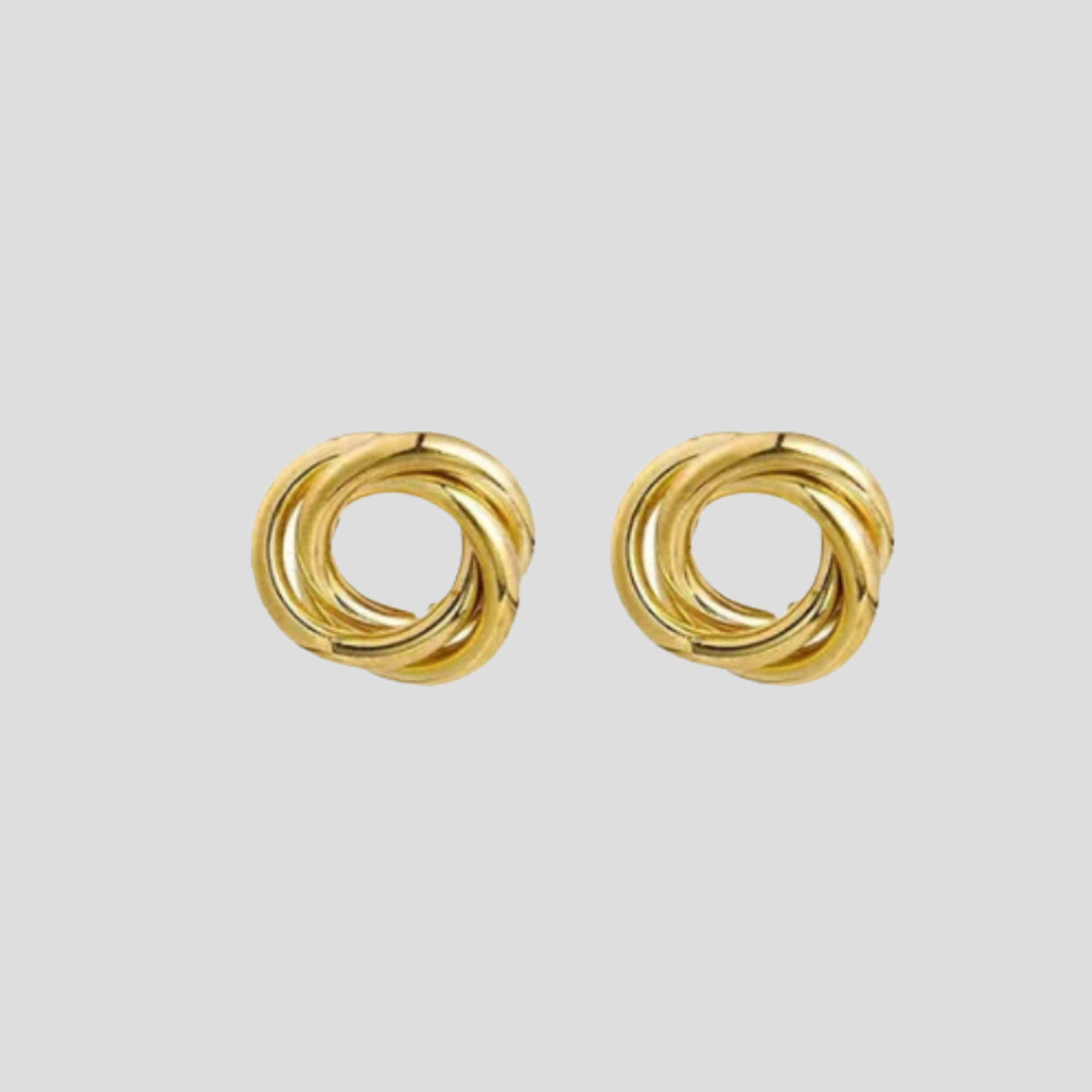 Gold-tone interwoven knot stud earrings with a polished outline for everyday wear