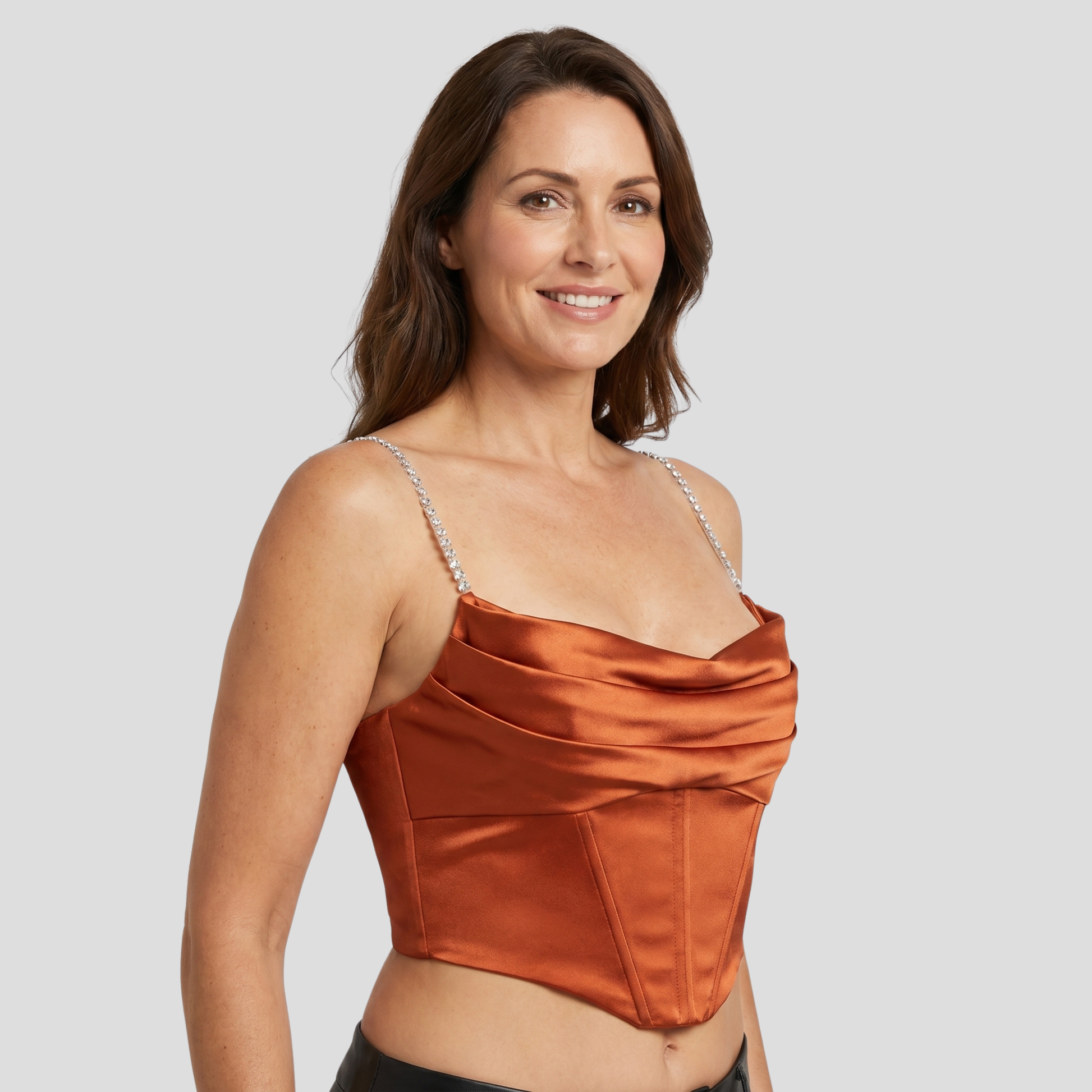 Orange corset cami top with draped neckline and embellished straps for occasion wear