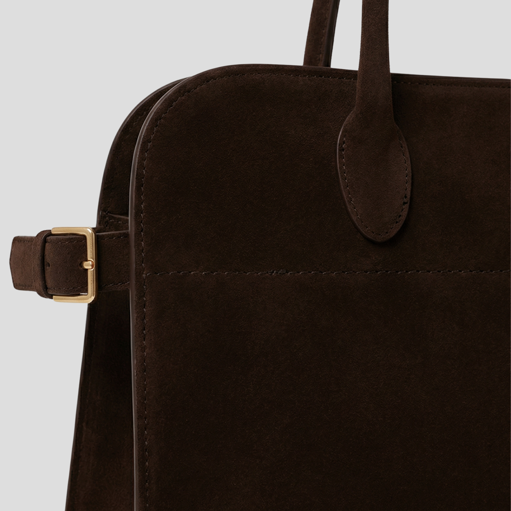 Brown structured everyday handbag with front buckle accent